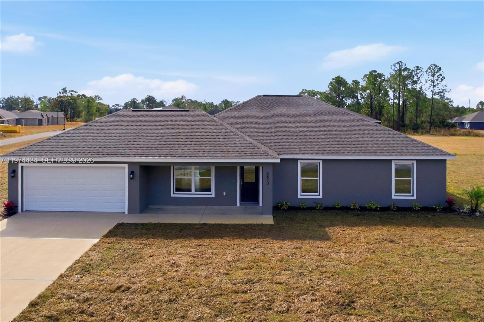 Welcome to the Everglades model, a brand-new construction in the sought-after Sun ‘n Lake of Sebring Improvement District, where you can enjoy the golf community lifestyle without the restrictions of an HOA. Situated on an oversized nearly half-acre lot, this newly completed 4-bed, 2-bath, 2-car garage home offers over 1,800 sqft of modern living space. Step inside and you’ll immediately notice the light, open layout and neutral color palette that makes the home feel bright and clean. The kitchen is designed to impress with quartz countertops, shaker cabinetry, stainless steel appliances, and plenty of counter space, making it ideal for both everyday living and entertaining guests. The spacious primary suite provides a relaxing retreat with dual sinks, a walk-in shower, and generous space to unwind, while the split floor plan offers privacy for family and visitors. Additional features include an inside laundry room, irrigation system, and finished 2-car garage. Living in Sun ‘n Lake means more than just owning a home — it’s a lifestyle. Residents enjoy access to two championship golf courses, tennis and pickleball courts, community pool, fitness and recreation center, dining, and year-round activities, all within one of Sebring’s most desirable communities. New homes on oversized lots in Sun ‘n Lake are hard to find, and this one is move-in ready. Schedule your showing today and see why so many buyers are choosing Sun ‘n Lake for their next home.