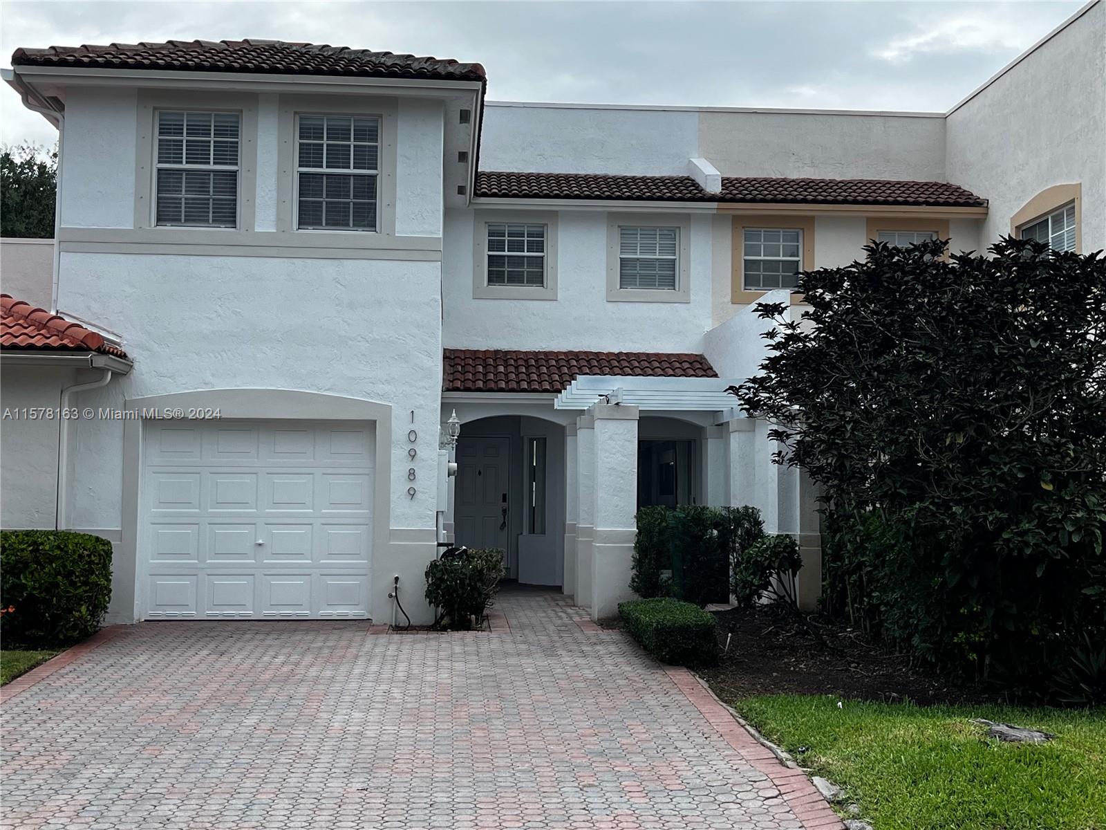 Extraordinarily Captivating Townhome with 24-Hour Security and Private Outdoor Space! Tucked away in the exclusive community of The Courts at Doral Isles, this 3BR/2.5BA property welcomes with a custom paver patio, classic Spanish tile roof, and tasteful landscaping. Fabulous for entertainment-centric lifestyles, the residence features an openly flowing layout, soft natural light, a large living room, and an open concept kitchen with stainless-steel appliances and granite counters. Each bedroom is well-sized with a dedicated closet, while the primary bedroom enjoys an en suite boasting a jetted tub, separate shower, and dual sinks. Other features: 1-car garage w/epoxy floors, laundry area, steps to Doral Island Club, community pool and playground, near shops, and more! Call now for a tour!