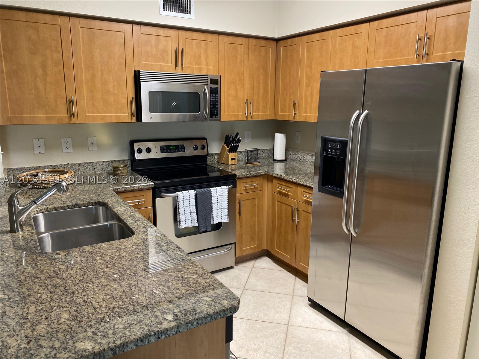 Great property, apartment UNIT #303, located just west of Florida’s Turnpike and 20 minutes from Downtown WPB. Gourmet kitchen with granite countertops and stainless steel appliances. Convenient full-size laundry room. Two parking spots. This meticulously maintained community offers resort-style amenities: two pools, tennis courts, and a luxurious clubhouse with a fitness center. Water, sewer, cable, and trash included with no rental restrictions.