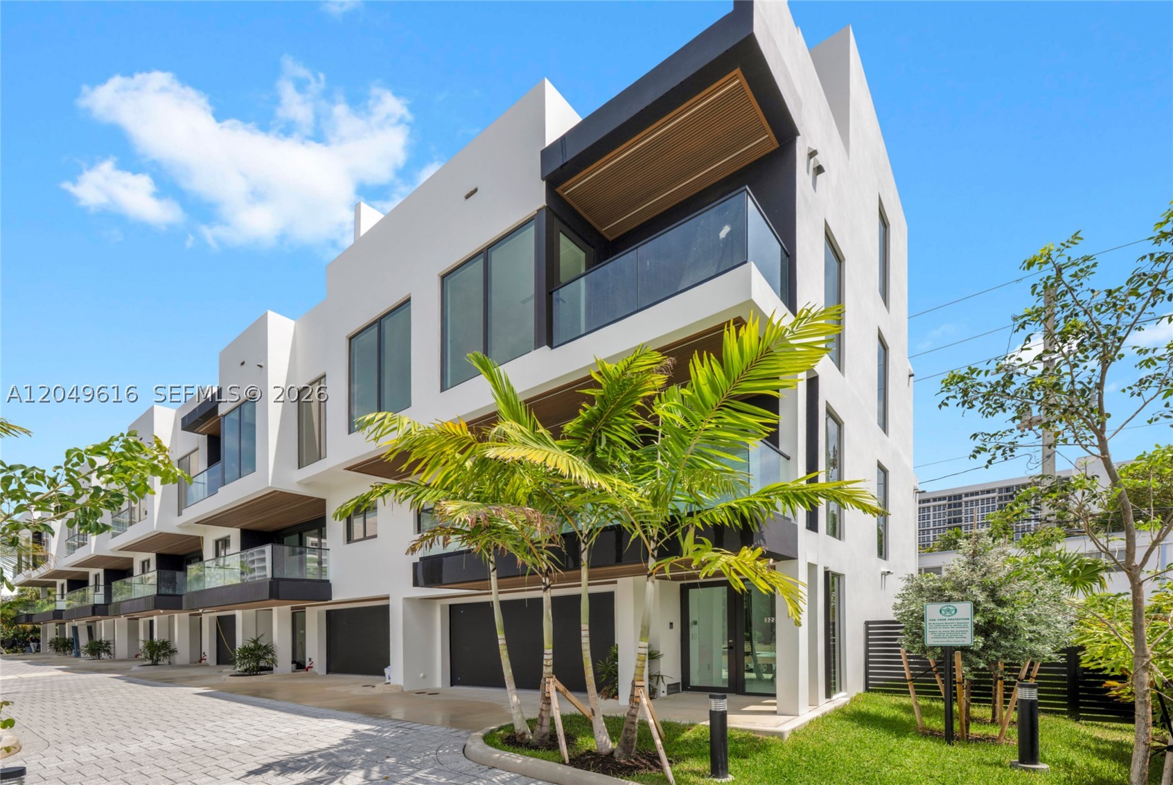 Welcome to Ocean Azul, an exclusive collection of six brand new never lived in luxury townhomes just steps from the beach and a short walk to the Pompano Beach Pier. This 2,553 SF residence features 3 bedrooms, 3 full bathrooms, 1 half bath, private elevator, and a 2-car garage with EV charger and epoxy flooring. Designed with premium finishes throughout that are normally reserved for much more expensive homes, including oversized built-in Sub-Zero and Wolf appliances throughout, Sub-Zero wine fridge, custom built-out closets, electric blinds throughout, Sonos sound system, and smart home ready system. Enjoy a spectacular rooftop terrace with outdoor kitchen, built-in BBQ, refrigerator, ocean views, and space for a hot tub or cold plunge. Additional guest parking on-site. Experience modern coastal luxury in one of Pompano Beach’s most desirable beachside locations.