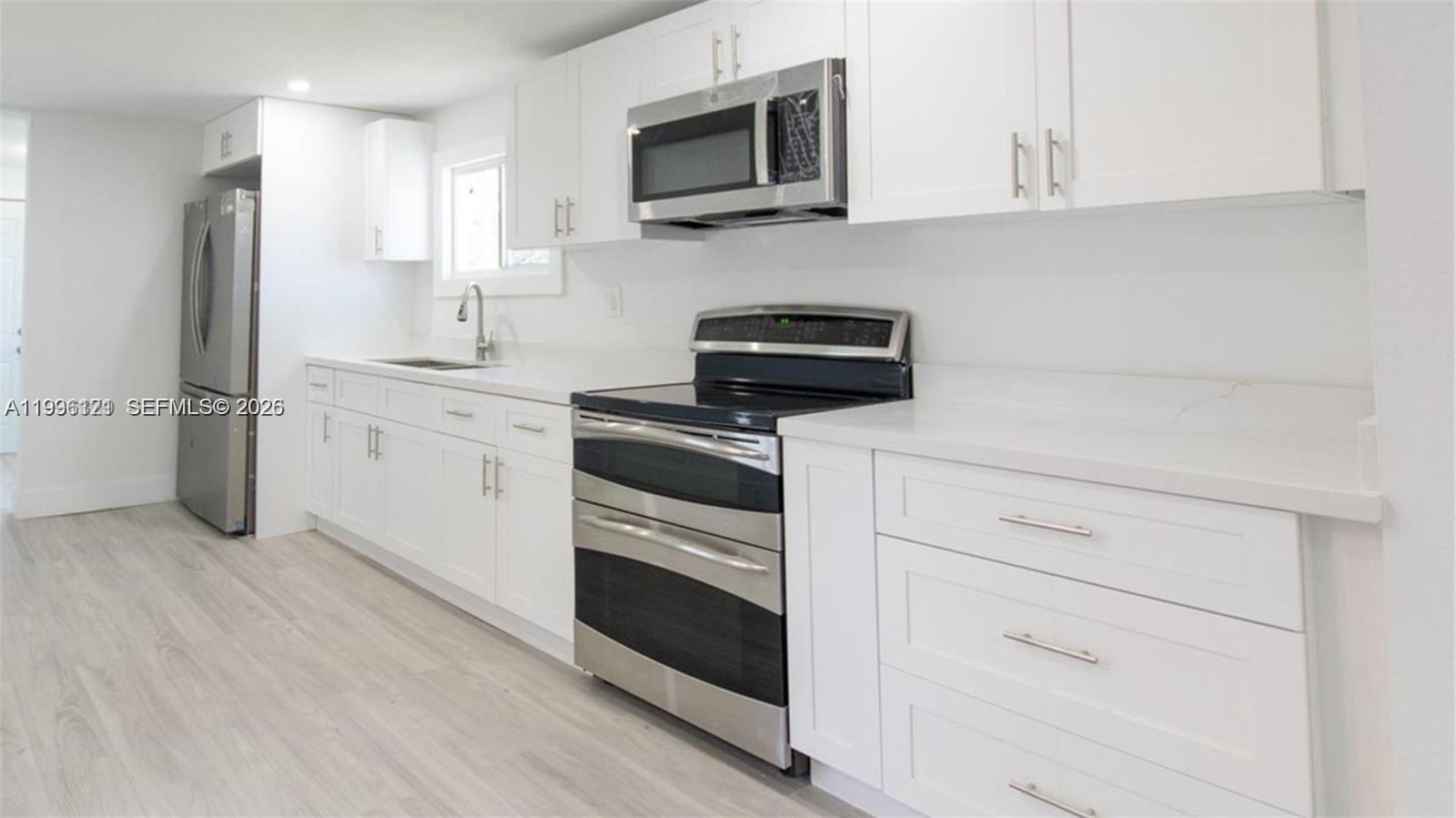 Dream home ready to move in! This beautiful 3-bedroom, 2-bathroom residence features spacious living areas, laminate flooring throughout, and freshly painted interior/exterior. The updated kitchen boasts stainless steel appliances, while the bathrooms have been upgraded with modern fixtures. Situated on a large corner lot with plenty of room for storage and entertaining. This fully remodeled home won't last long! Just minutes from Downtown Miami, major highways, and supermarkets. A perfect move-in ready home waiting for you!