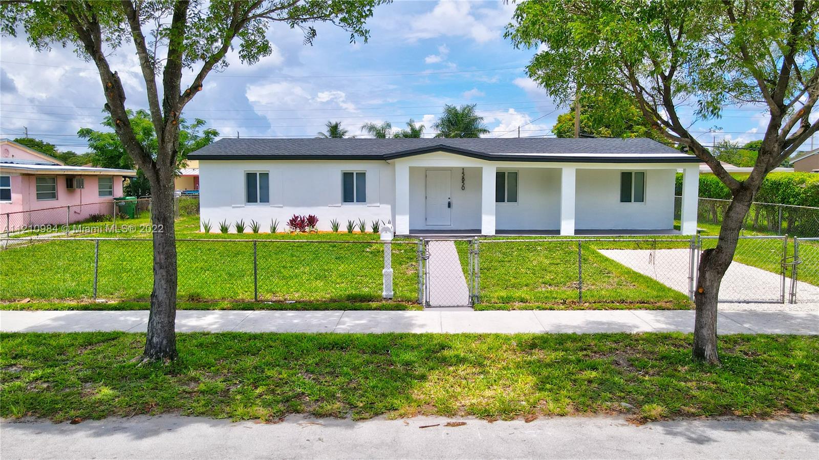 Beautifully renovated 4 bedroom 1 bath, with large side family room with a side entry.  Updates include: custom modern kitchen with breakfast counter, custom kitchen pantries, quartz countertops/backsplash, new stainless steel appliances, updated modern bath, new 3-dimensional shingle roof, new impact windows, new hurricane approved doors, new interior doors, new closet doors, new laminate flooring throughout with new modern baseboards,  tankless water heater, repainted interior/exterior, central ac with new ac ducts throughout, new landscaping, new light fixtures including recessed lighting.  Won't last!!!