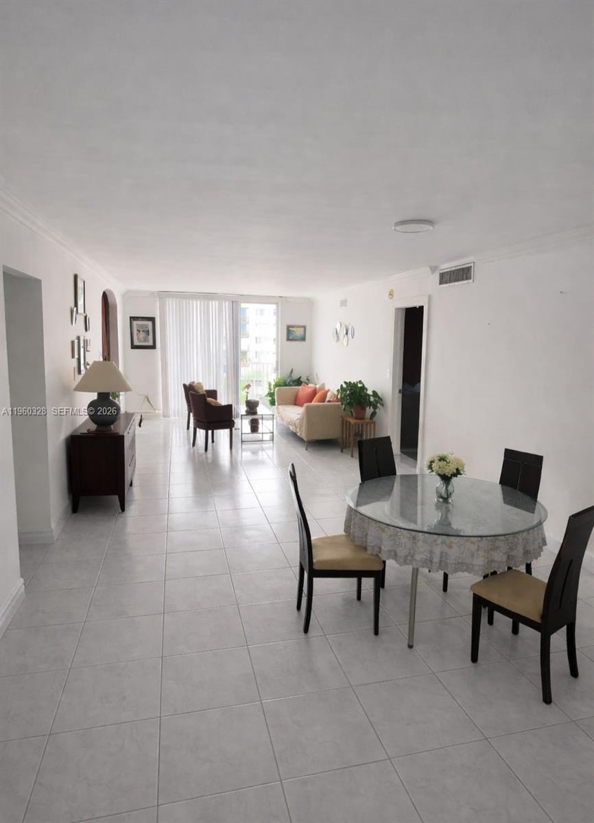 Spacious 2-bedroom, 2-bath + den condo in the heart of North Miami. The den can be used as a home office, guest room, or potential 3rd bedroom. Bright unit with ceramic floors throughout, ample living/dining area, and generous closet space. Located in a well-maintained building with elevator and assigned parking. Conveniently close to shopping, dining, schools, and major highways. Great opportunity for end-users or investors. Easy to show.

Association Information:
Monthly association fee is $698.37.
Special assessment of $71.49/month in effect from August 2025 through July 2026.
Additional lifetime reserve contribution of $119.91/month.

Buyer to verify all association information, fees and assessments directly with the association.