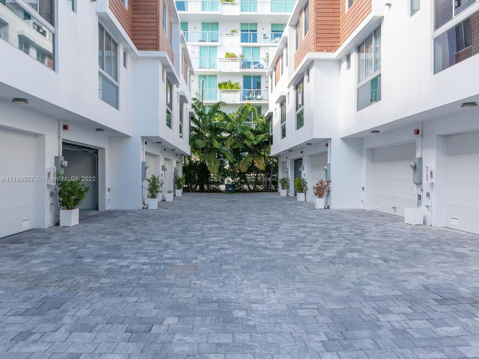Your Chance to live in This beautiful 2019 new construction 3-story townhouse with a Stunning private rooftop oasis! 4 Bedrooms and 3.5 Bathrooms, New construction means you are one of the first to live in this beautiful townhome. East facing means tons of natural light - wake up to the sun! No expense spared! The interior features high-end: kitchen with marble countertops, a master bedroom with a large walk-in closet, and a marble bathroom. rooftop deck partially covered, jacuzzi, BBQ, and entertainment area. This modern home also comes with a covered 2-car garage, security system, and automated shades. Huge Kitchen with Open concept, High-end floors, and all the bells of smart home features! located in a Gated complex in the coveted bay harbor islands, This won't last!