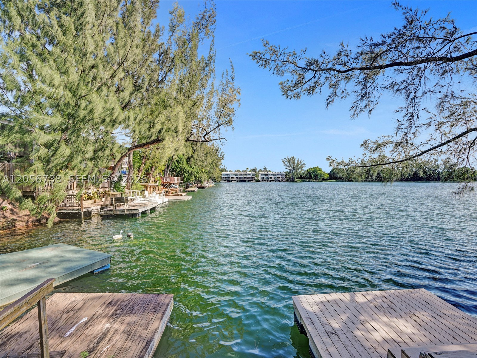 Few homes put you this close to the water. Set on picturesque Lakeridge, you get a private deck and your own dock on 22 acres of open water, with the lake just steps from the back door. Drop a paddleboard in before work, take the kayak out at sunset, or have your morning coffee while enjoying the view.

Inside, this two-story townhouse offers 2 bedrooms and 2.5 baths across 1,552 square feet, with the water in view from the living room and the bedrooms above. Impact-glass sliders front and rear pull in the light and the lake while keeping everything quiet and secure, and the in-unit washer and dryer make day-to-day living easy.

A true lakefront layout like this gives you a rare canvas, with room to bring your own finishes and make it your own. Behind the gates, Lakeridge offers two pools, a hot tub, tennis and pickleball, a walking trail, butterfly garden, and playground, all minutes from South Miami, Dadeland, UM, and Coral Gables. Come walk the dock and see the water for yourself.