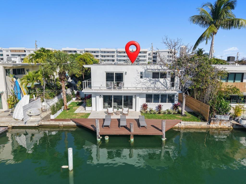Prime Waterfront Gem in Miami Beach 7286 Gary St. Location, Location Location! Welcome to this beautifully remodeled waterfront property featuring a rare 60 FT dock on a wide canal with direct, bridge free access to the bay. Walking distance to the beach. Inside, you will find 1,632 SqFt of luxurious living space. This home has been completely updated with brand new electrical, plumbing, HVAC, roofing and gas lines. The first floor boasts elegant white porcelain tile floors, a modern white kitchen with quartz countertops and new appliances, and expansive impact windows and doors the provide the home with natural light and stunning water views. Upstairs, you'll find 3 bedrooms with engineered wood floors and a large wraparound terrace to enjoy those serene water vistas. The bathrooms are appointed with elegant marble floors, and the property features manicured landscaping and a spacious yard perfect for entertaining. Home is equipped with alarm system. NO HOA!