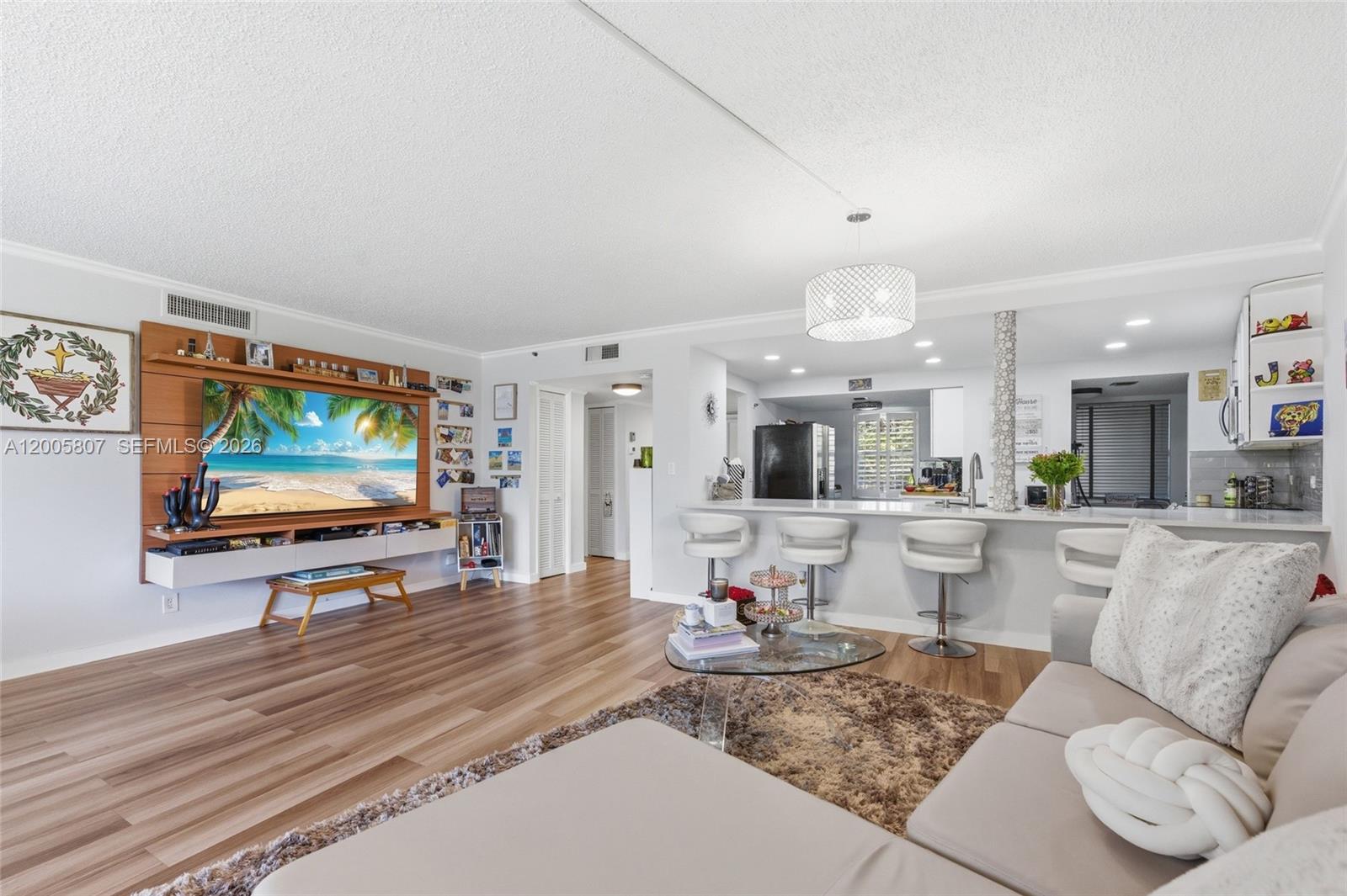 Welcome To This Oversized 2 Bed / 2 Bath Condo With Open Floor Plan Located In The Prestigious Palm Aire Country Club. This Move-In-Ready Unit Boasts A Spacious Open Floor Plan Featuring Luxury Vinyl Flooring And Elegant Plantation Shutters Throughout. The Large Eat-in Kitchen Is A Chef's Dream, Complete With White Shaker Cabinets, Quartz Countertops, Stainless Steel Appliances, And Abundant Storage. Relax And Enjoy On The Large Screened-in Patio With A Panoramic Views Of The Manicured Golf Course. Primary Suite Features A Ceiling Fan, Golf Views, And An Upgraded Bath With A Smart Mirror And Quartz Vanity. Enjoy The Convenience Of A Full-size In-unit Washer/dryer And A Separate Storage Unit. Peace Of Mind Comes Standard With A Brand New Roof (2025), Newer AC (2022), And A Well-maintained Building That Has Completed Its 40-year Inspection With Reserves. HOA Fee Is All-inclusive Of Cable, Internet, Water, Sewer, Trash, Exterior Insurance, And Roof Maintenance. Located In An All-ages Building With NO Mandatory Golf Membership Fees. Association Requires Minimum 700 Credit Score And 20% Down Payment.