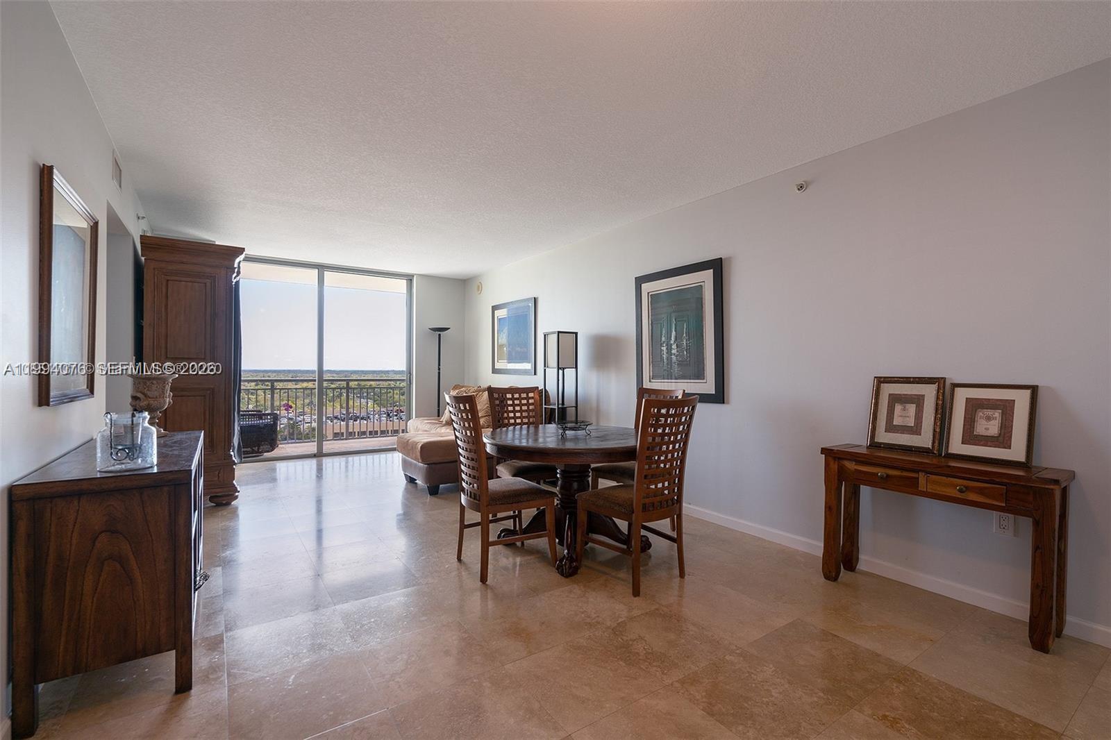 Discover this beautifully updated one-bedroom, one-bathroom apt in the heart of Downtown Dadeland.  This residence has been thoughtfully refurbished with attention to detail, featuring brand new hardwood floors in the bedroom and spacious walk-in closet, and elegantly polished marble floors throughout the living, kitchen, and bathroom areas. 

The updated bathroom adds a modern touch, creating a fresh and comfortable living experience.  From this 12th-floor apartment, you'll enjoy unobstructed views of Pinecrest and the surrounding area, offering a peaceful backdrop from your home. 

The apt will include brand new amenities that are being rebuilt, an excellent parking space conveniently located near the building entrance.

Downtown Dadeland offers one of Miami's most desirable lifestyles, perfect for UM students, professionals, and anyone looking for convenience. Enjoy being minutes from Dadeland Mall, Publix, and exceptional restaurants, shopping, and entertainment. 

A rare opportunity to own a move-in-ready home in a prime location. 

Assessment for new amenities will be paid at closing by the seller.