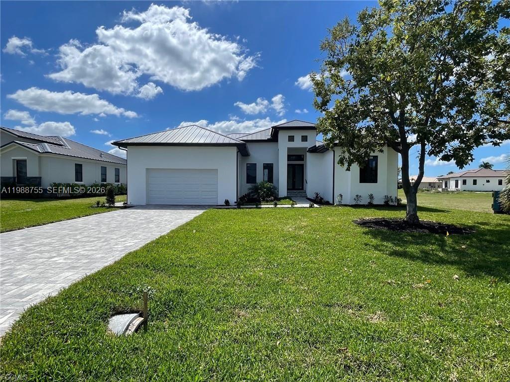 This BRAND NEW 4 bedroom/3 bath custom-built home, located within the Burnt Store Lakes development (a subdivision of Punta Gorda Isles) is nearly complete and ready for you. The home's open floor plan is refreshingly unique and features any number of designer-inspired touches including exquisite tile flooring throughout, recessed lighting as well as contemporary lighting fixtures, ceiling fans and beautiful tray ceilings highlighting select rooms. The kitchen is graced with a substantial island, a stainless-steel appliance package and quartz counter-tops as well as ample cabinet and counter space. The spacious living/dining area adjoins the kitchen and provides access to the primary lanai (under truss) through an impressive three panel sliding glass door. The lanai, complete with a metal railing, can also be accessed through the dining area as well as one of the other bedrooms. The fourth bedroom could also be used as an office or media room - an option so many homes lack today. The master bedroom features a tray ceiling, large closet and an over-the-top ensuite with a fully tiled shower and a dual vanity. Additionally, the master's private lanai (complete with a metal railing) is accessed through a 2-panel slider and overlooks the backyard providing an ideal spot to just sit back and relax. The guest bathrooms feature double sinks while one has a tub/shower combo and the other a fully tiled shower. The handy laundry room has washer/dryer hookups and provides additional storage as does the attached 2-car garage. The home has a sturdy metal roof, impact resistant windows and doors for added storm protection. Exterior features include an impressive, covered entryway, a paver-laid driveway and walkway and an automatic sprinkler system. The home is on both water and sewer. NOTE: Some of the photos in this listing have been digitally enhanced so as to provide a more accurate depiction of the home when completed. **This is a Bank Owned Property**