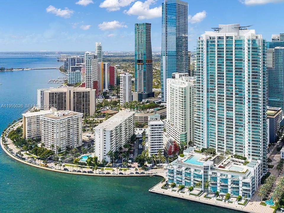 The Jade Brickell offers a lifestyle of exclusively and convenience perfectly located near great dining, shopping and entertainment. This is a stunning 4 bd, 4 1/2 bath condo perched high on the 42 floor boasting pure elegance with unparalleled Bay and Ocean views, immercing  in serenity and style.  Your private elevator opens directly into your foyer with an expansive living room for entertaining. Chef's kitchen, renovated with top-of-the-line appliances. Sub Zero Refrigerator/Freezer plus cold drawers. Wolf induction stovetop, oven, steam and convection ovens, microwave, Miele coffee makder, Bosche dishwasher, insta hot water dispenser and wine cooler, 2 a/c's (2024). A luxurious primary suite, plus 3 additional bedrooms, each with private baths. Control 4 Smart Home-temperature, sound, lighting and shades.