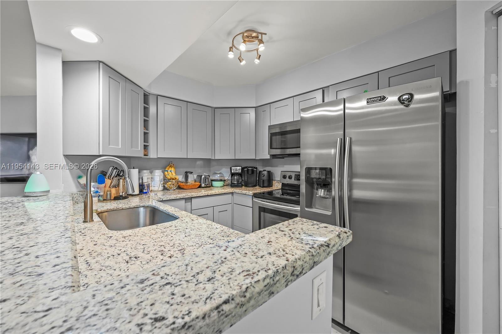 Welcome to your new home! Nestled in the heart of Plantation, this charming 2-bedroom, 2-bathroom condo offers the perfect blend of comfort and convenience. Step inside to find beautiful ceramic wood floors that flow throughout and lots of natural light, creating a warm and inviting atmosphere. The updated kitchen is a true highlight, featuring modern finishes and plenty of space to cook up your favorite meals.  From the living room, slide open the doors to your own screened-in patio, a peaceful spot to sip your morning coffee or unwind after a busy day. When you’re ready to cool off, the community pool is just a few steps away, offering a perfect escape for sunny afternoons. Location? It couldn’t be better. You’re just next door to Plantation Walk, where you’ll find upscale dining, boutique shops, and everything you need. Trader Joe's and Whole Foods are just around the corner, and the beach is only a short drive away. Plus, with easy access to 595, getting anywhere you need is a breeze. This condo also offers plenty of guest parking.   It’s more than just a place to live; it’s a lifestyle. Don’t miss out—this one won’t last long!! New roof, A/C 3 years old and stackable washer/dryer.  Plenty of closet space.