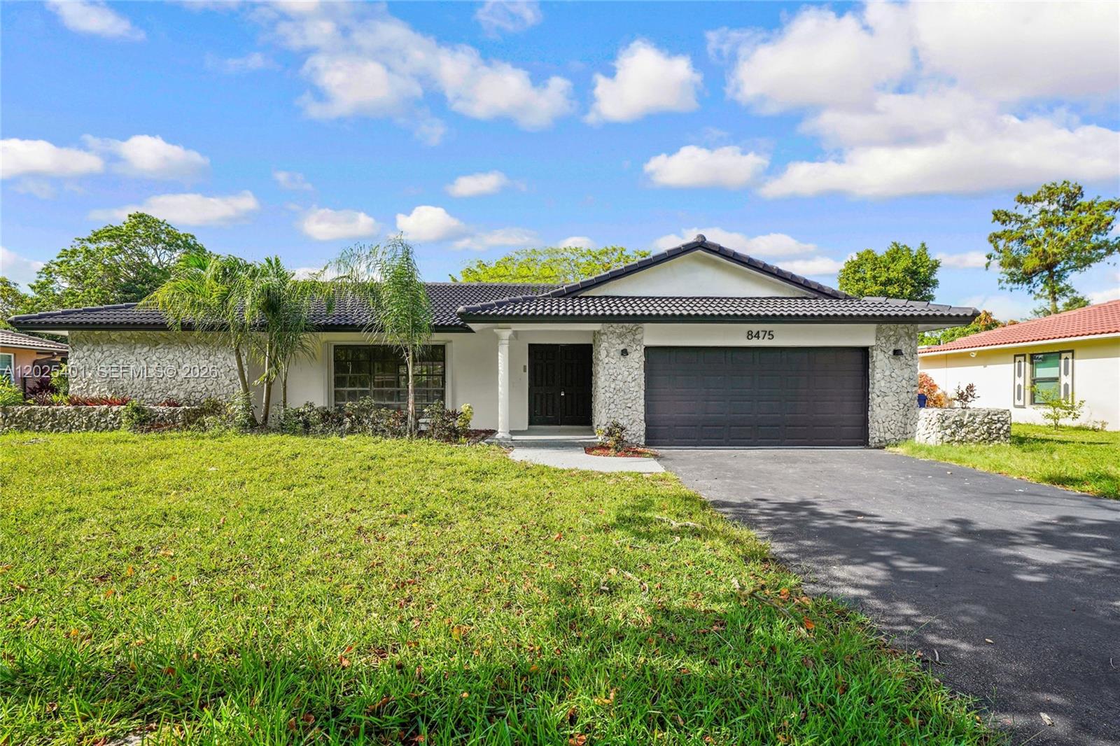 Welcome to this beautifully remodeled residence in the desirable Shadow Wood community of Coral Springs. This spacious 4-bedroom, 2.5-bath home offers over 2,100 square feet of refined living space, a 2-car garage, and a generous lot designed for comfort, privacy, and everyday enjoyment. Thoughtfully updated throughout, the home features a fresh modern interior, renovated kitchen and baths, new flooring, fresh paint, new countertops, and a bright open feel ideal for both entertaining and relaxed family living. The fenced backyard offers excellent outdoor space with room to gather, unwind, or create your own private South Florida retreat. Ideally located near parks, shopping, dining, schools, and major roadways, this move-in-ready Coral Springs home delivers the perfect blend of style, space, and convenience.