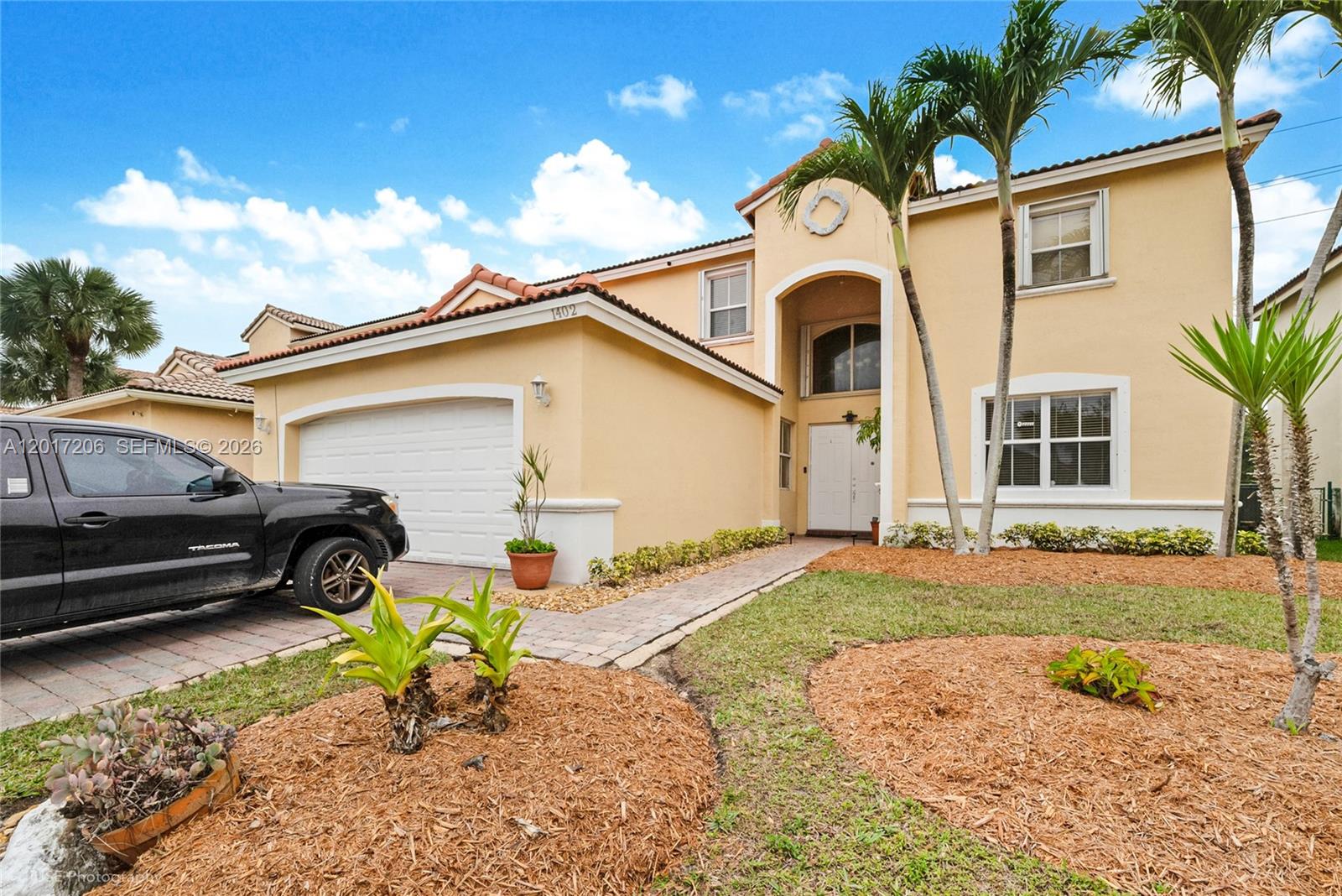 Well-maintained home located in Homestead, Florida, featuring a functional layout and bright, expansive living spaces with soaring double-height ceilings. The second floor showcases a unique bridge connecting bedrooms on both sides of the home, creating an open and airy feel. The spacious open kitchen flows seamlessly into the breakfast nook and formal dining room, complete with a butler’s pantry—ideal for entertaining. A first-floor bedroom provides added convenience, with a total of four bedrooms overall. An additional open area off the foyer offers flexibility for a home office or multipurpose space. The two-car garage provides ample storage and parking. Enjoy a large lakefront backyard with plenty of room for outdoor activities, entertaining, or future enhancements. Conveniently located near shopping, dining, parks, and major highways for easy commuting. An excellent opportunity for homeowners or investors in a growing South Miami-Dade community.