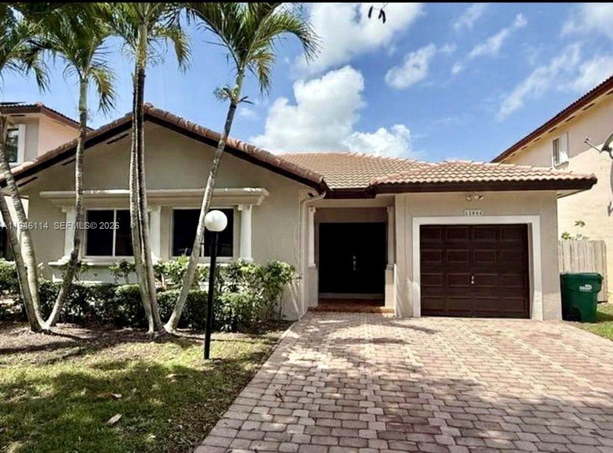 READY TO MOVE IN ! Welcome to this beautifully remodeled 3-bedroom, 2-bath including a den/home office that can easily be used as a 4th bedroom. in the desirable Silver Palms community. This one-story home with a one-car garage and 2-space driveway offers comfort, style, and flexibility.  Enjoy Florida living at its best with new porcelain flooring, covered terrace and spacious patio with trees , offering plenty of room for a future pool, BBQ area, and family gatherings. Inside, you’ll find a brand-new kitchen featuring full quartz backsplash and countertops, stainless steel appliances, and modern finishes. Both bathrooms have been upgraded with new vanities, quartz countertops, and designer mirrors. The home also features new recessed lighting throughout, updated electrical outlets and switches, and has been freshly painted. A rare opportunity — only one-story home currently available in the community.