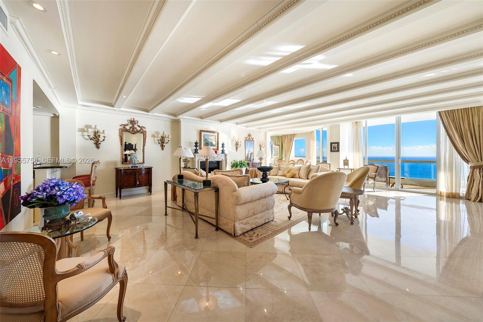 Indulge in refined oceanfront living at Acqualina Beach Resort & Residences with this elegant 4-bedroom, 4-bath residence (Unit 4103). Enjoy breathtaking Atlantic Ocean and city views through floor-to-ceiling glass, an open-concept layout, and expansive terraces accessible from every room, including the kitchen—ideal for indoor-outdoor living and entertaining. 

The residence welcomes you with a grand foyer featuring trompe-l'œil artwork by two British artists with prior work at Windsor Castle, setting a truly distinctive and sophisticated tone. The home offers marble flooring throughout, custom crown moldings, dentil detailing, custom-made bookcases, and a fully custom-built bar, showcasing exceptional craftsmanship and bespoke design.

Residents enjoy private beach service, resort-style pools, fitness center, Acqualina Spa by ESPA, 24-hour concierge, valet, security, and on-site dining including Il Mulino New York, Avra Miami, Ke-uH, and Costa Grill. Ideally located in Sunny Isles Beach near Bal Harbour Shops, Aventura Mall, fine dining, and major airports.