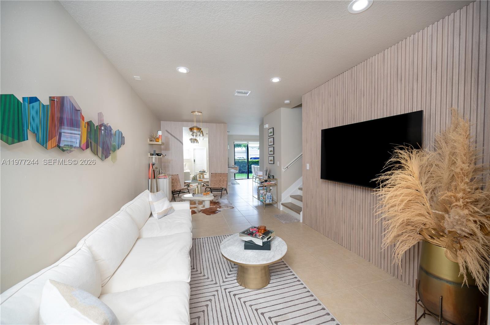 Beautiful 3-bedroom, 2.5- bath townhouse located in the desirable gated community of Champion Lakes. This two-story home offers 1,777 Sq.Ft. of living space with a bright and functional layout. The property has been tastefully updated with new flooring and baseboards throughout, and a renovated primary bathroom that adds a modern touch. Enjoy a private outdoor area with upgraded pavers, perfect for relaxing or entertaining. The community offers excellent amenities including a pool, playground, tennis courts and walking areas. Conveniently located near Aventura Mall, major highways including I-95, SR-7 and 826, as well as shopping and dining. A wonderful opportunity to own a move-in ready townhouse in a gated community. 1-car garage plus driveway parking for 2 additional