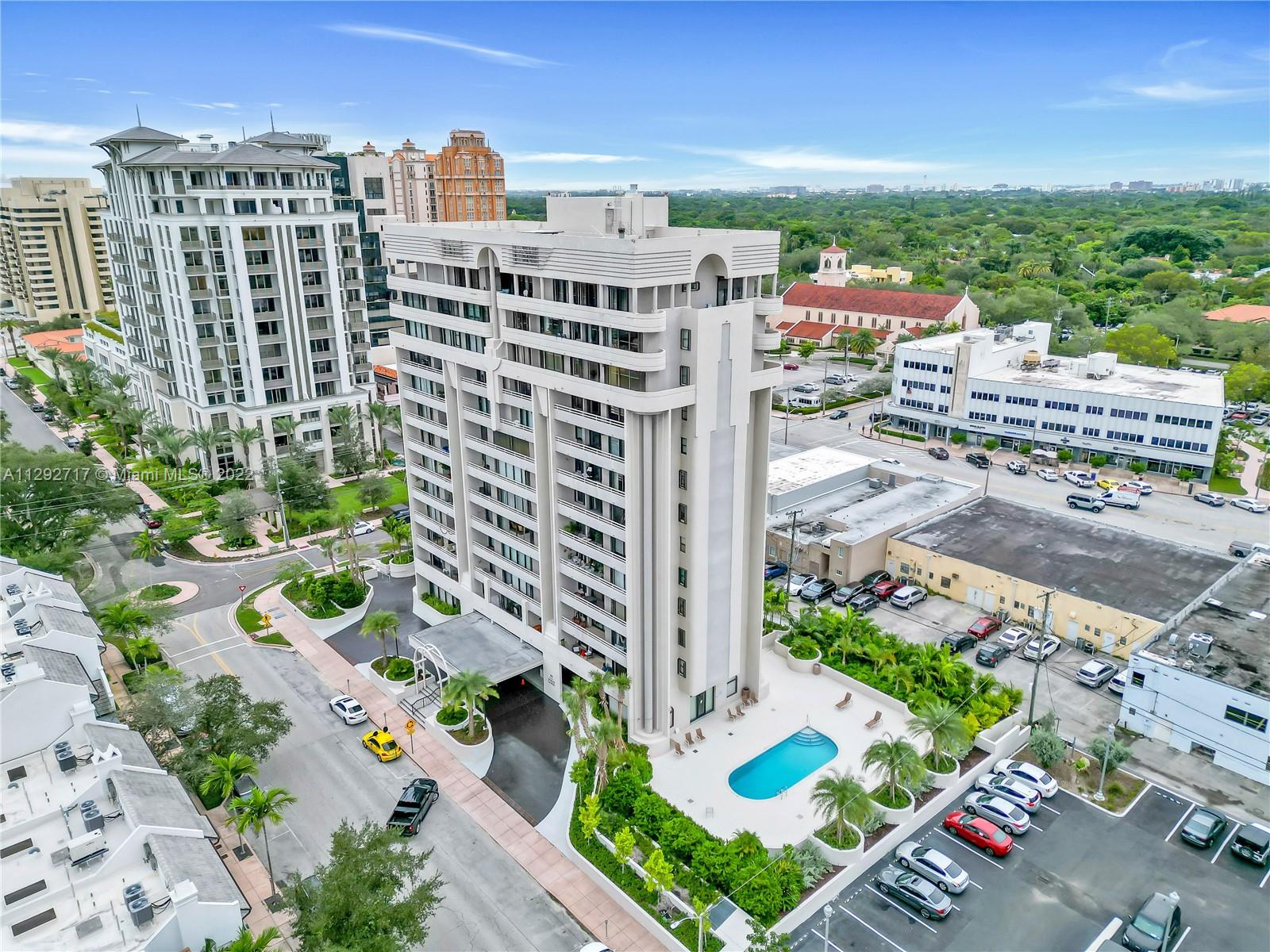 Here is the perfect Coral Gables boutique building in a sought-after location! This spacious split-plan unit is flooded with natural light from the floor-to-ceiling glass doors. The generous sized primary bedroom includes 3 closets, marble bathroom with dual sinks, water closet & access to balcony. The second bedroom currently used as office/den has a private bathroom & ample closets. Other highlights include tiled floors, washer/dryer in unit, powder bath, 1 covered parking spot plus additional storage (1 on 5th floor the other in parking garage).  Bldg has pool & gym. All this within walking distance to Miracle Mile, downtown Coral Gables shops, restaurants, theaters, supermarkets, and the free trolley.