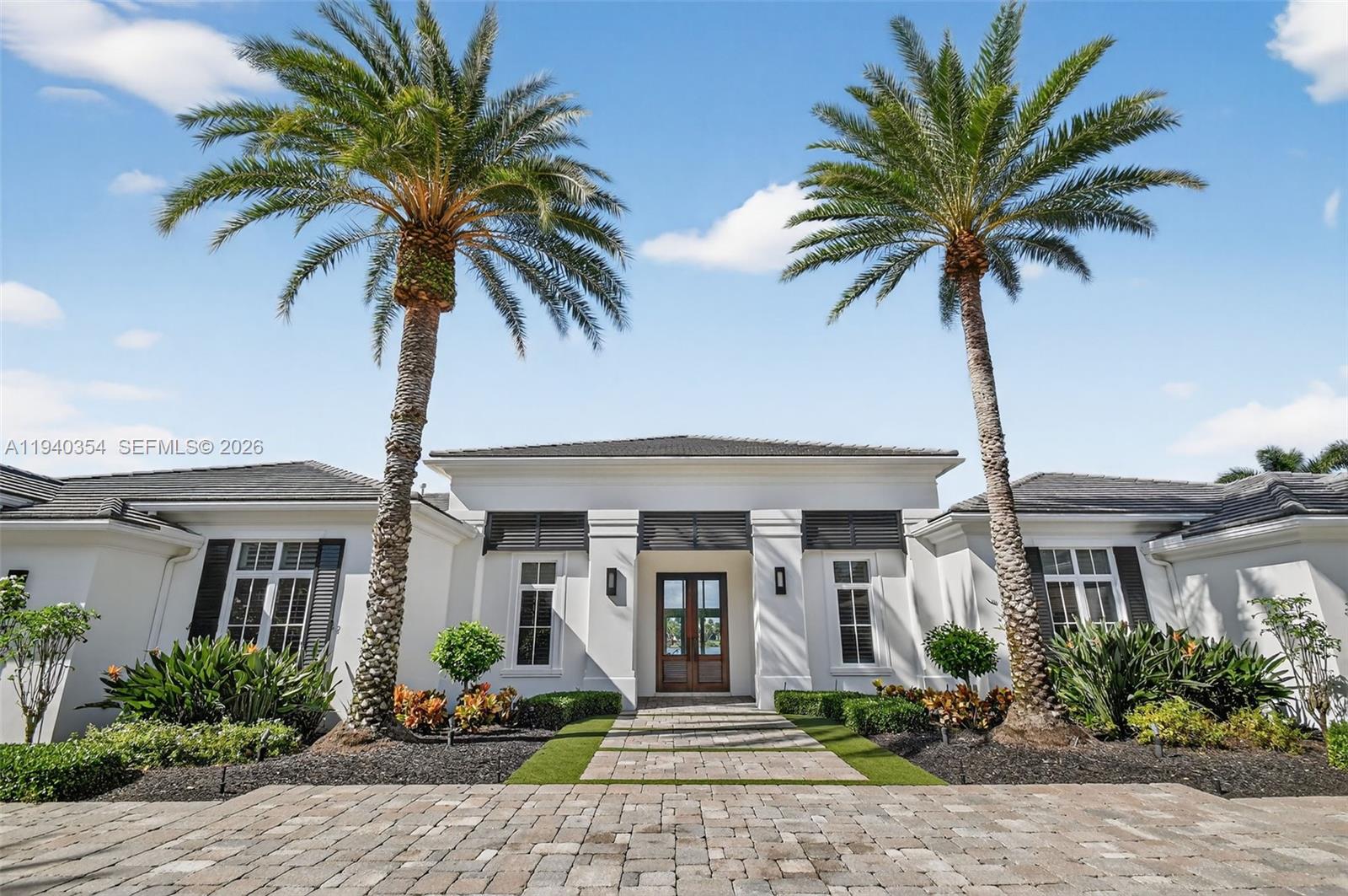 A truly exceptional lakefront estate in the prestigious Frenchman’s Reserve Country Club of Palm Beach Gardens. This refined residence captures expansive, unobstructed lake views, creating a tranquil and visually striking backdrop for everyday living and grand entertaining. Thoughtfully designed interiors offer generous proportions, sophisticated architectural detail, and seamless indoor-outdoor flow. A rare and remarkable highlight is the oversized 6-car garage with professional lifts accommodating up to nine vehicles, ideal for the discerning automobile collector. Located within a private, gated community renowned for its championship golf course, resort-style amenities, and impeccable service, it is ideally located just minutes from world-class dining, shopping, beaches, and Palm Beach International Airport.