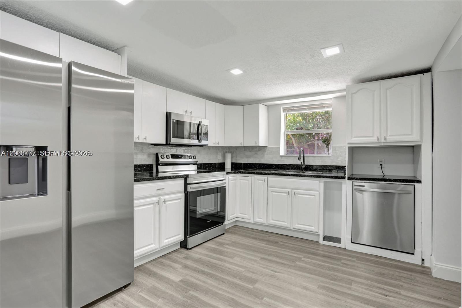 Beautifully renovated home with brand new roof, freshly painted inside and outside, new kitchen with quartz counter tops, backsplash, cabinets, new ss appliances, vinyl waterproof flooring and ceramic tile, new LED lighting in the entire home, AC well maintained, washer and dryer; split floor plan with 3 beds/2 baths, spacious driveway with plenty of space to park and nice size yard. Great location near shopping, restaurants, Downtown Ft Lauderdale & Airport, beaches. Tenant to pay for all utilities and lawn care ($80.00 a month).