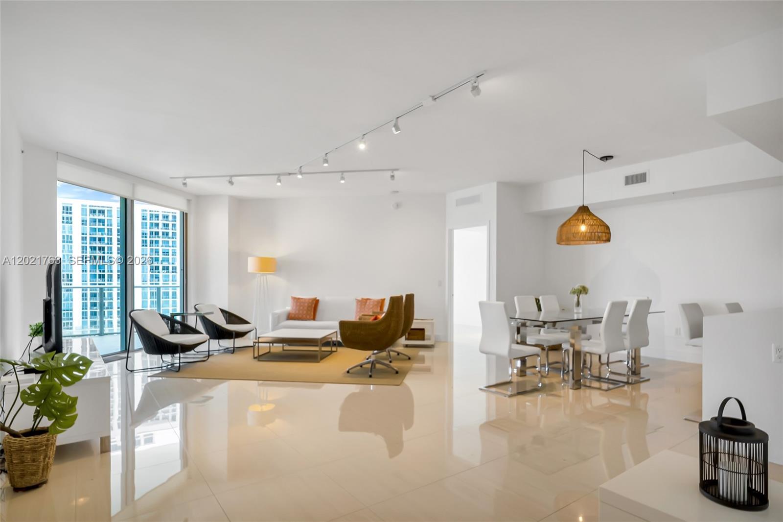 Welcome to Marina Palms Yacht Club and Residences, North Tower! This elegant 2-bedroom, 2.5-bath residence has 1,736 square feet, boasting a large living and dining room for all your entertaining needs. Enjoy a very large balcony with spectacular marina and Biscayne Bay views,  skylines od Sunny Isles Beach and Downtown Miami, accessible from every room. The unit features split and large bedrooms, ceramic tile throughout, a breakfast counter in the open kitchen, a walk-in closet with built-ins, and in-unit washer and dryer. South exposure brings in natural light and stunning views of the water. Plus, enjoy two parking spaces and top-notch building amenities: pool, fitness center, BBQ area, playground,  health club, yoga studio, pilates studio, news cafe, and party room with screening room, billiards room, and resident's lounge. The building has full service marina. Enjoy the personal services such as valet, concierge, guarded gate house and 24 hours security. Walking distance to restaurants, minutes to the beach, Bal Harbour, Aventura, Sunny Isles. Ready to move in. Easy to show, call listing agent.