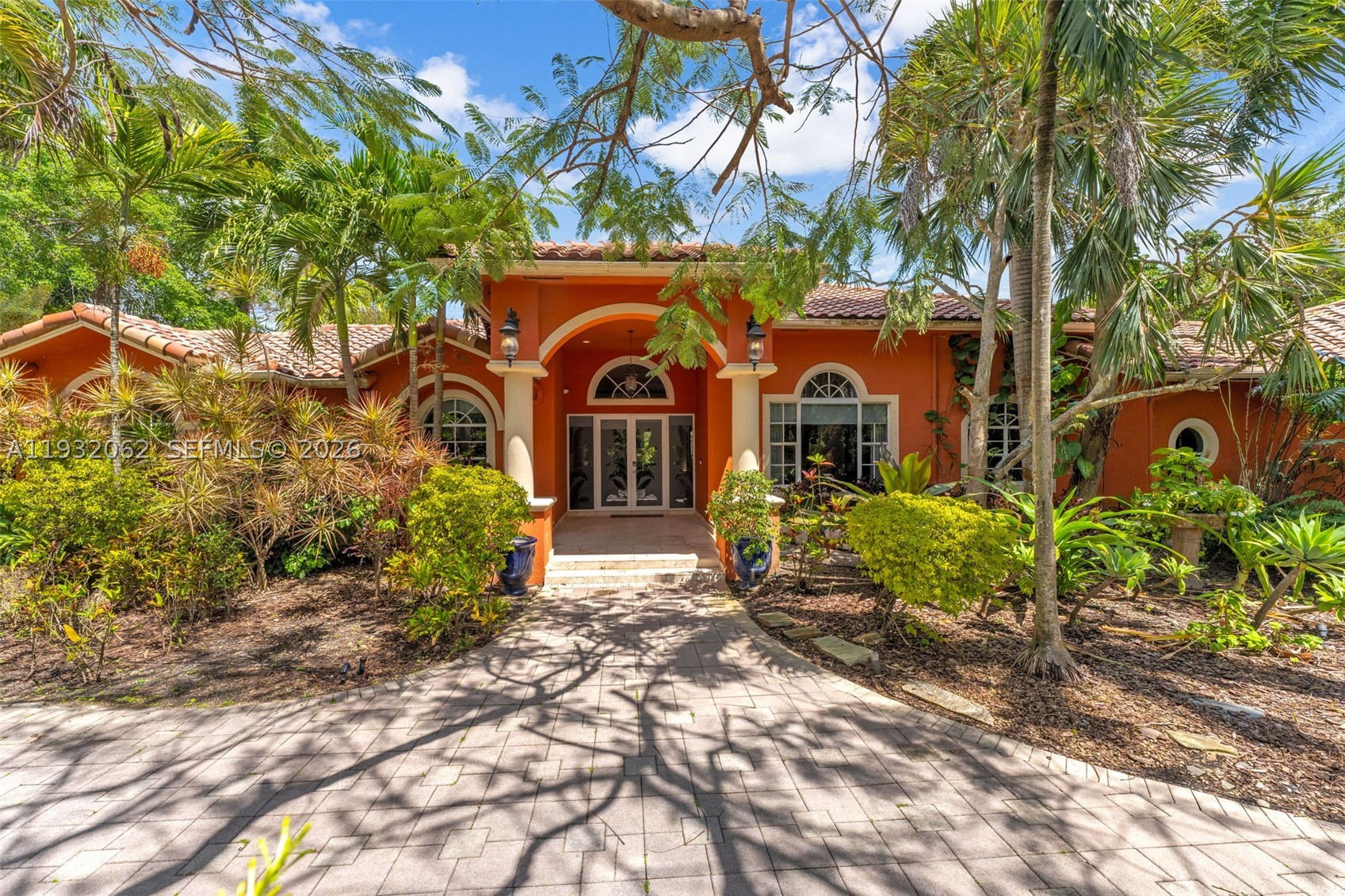 Located on a quiet street in the heart of Pinecrest, this elegant estate blends timeless architecture with refined modern living. Built in 1997, the residence offers 6BD/5.5BA and a designed split floor plan that balances privacy and functionality. Grand double-height ceilings and an expansive formal living and dining areas create a sophisticated ambiance throughout. Designed for both everyday living and upscale entertaining, the gourmet kitchen features granite countertops, premium ss appliances, a generous center island, abundant custom cabinetry and a spacious family room complete with a built-in bar. Outdoors your own private resort-style retreat surrounded by lush tropical landscaping and mature trees. Additional highlights include a 3-car garage and an invisible dog fence for added convenience and security. A rare opportunity in a prime location with endless potential to personalize and create your dream home.