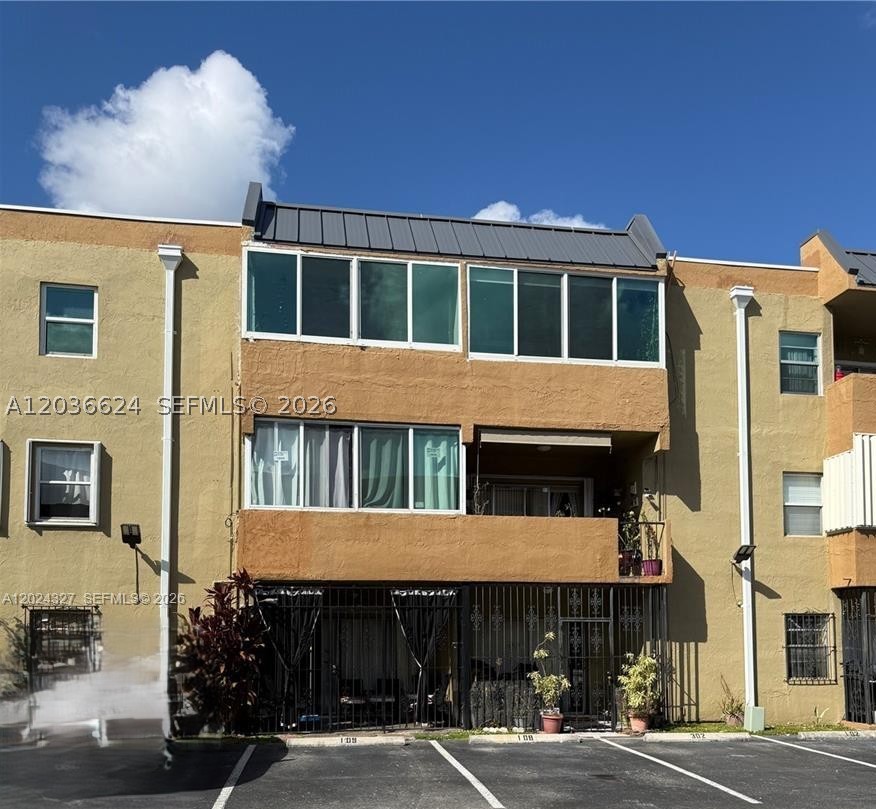 Welcome home to this stunning, move-in-ready 2-bedroom, 1.5-bath condo. Recently remodeled with modern finishes, this bright and spacious residence offers the perfect combination of comfort, style, and convenience. Features include an updated kitchen with stainless steel appliances, renovated bathrooms, elegant laminate flooring, and a large enclosed balcony with impact windows—ideal for a home office, study, or additional living space. The primary bedroom boasts a generous walk-in closet, while the open living and dining areas create a welcoming atmosphere for relaxing or entertaining. Located in a secure gated community with elevator access, a sparkling pool, assigned parking, and ample guest parking, this condo places you just minutes from Westland Mall, major hospitals, top-rated schools, restaurants, and the Palmetto Expressway for an easy commute. Enjoy the convenience of on-site laundry facilities and a well-maintained community designed for comfortable living. Don't miss this opportunity to live in one of West Hialeah's most convenient locations. Schedule your showing today and make this beautiful condo your next home!