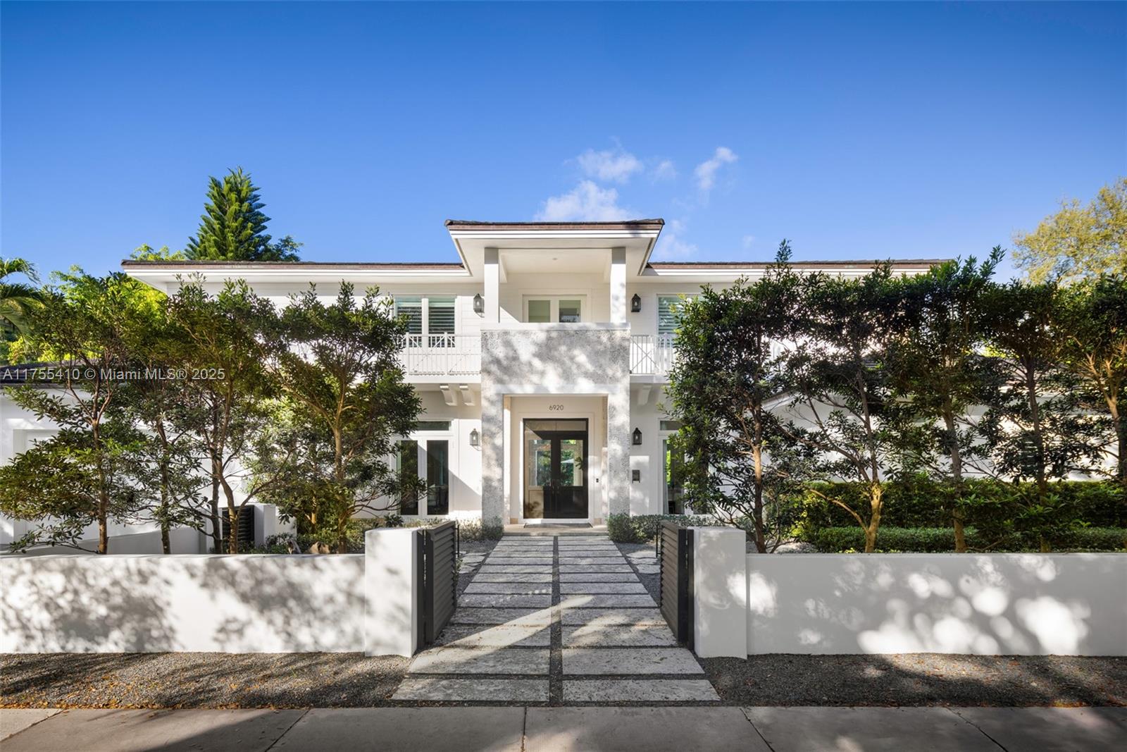 Welcome to 6920 Talavera, a stunning turnkey designer home located on one of the most desired streets in Coral Gables. This beautiful home features 3 bedrooms upstairs, including the master suite and two additional bedrooms connected by a Jack and Jill bathroom. The fourth bedroom is located downstairs offering flexibility and convenience. It also includes an elevator for added accessibility, along with a house generator. Functionality meets elegance with dual laundry rooms, one on each floor. Step outside to a covered terrace and summer kitchen, complemented by a cabana bathroom, making this home a entertainer's dream. Whether hosting gatherings or enjoying quiet outdoor moments, the terrace provides the perfect setting. Don't miss this rare opportunity in Coral Gables!