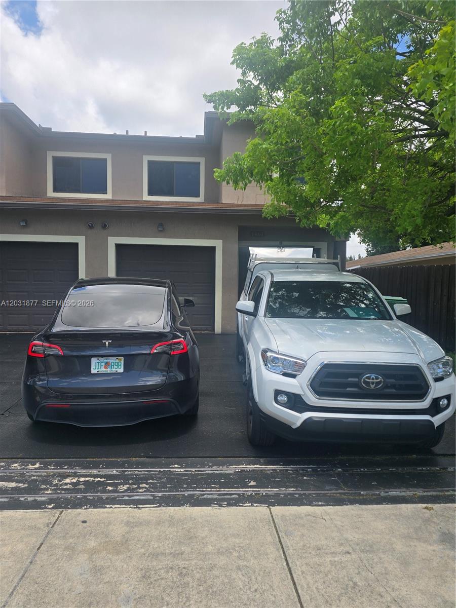 Freshly painted outside washer and dryer all tile 2 bedroom 2 bath central air granite counter impact window one car garage