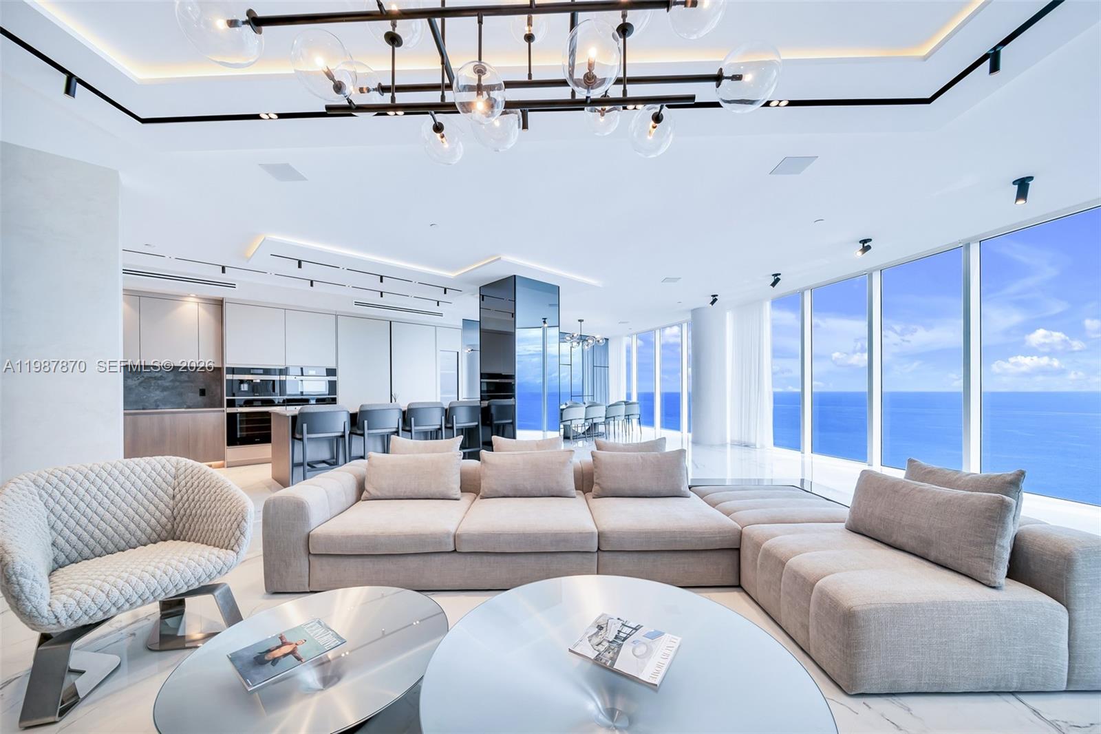 Indulge in an extraordinary level of luxury and sophistication where this one-of-a-kind, Turn key SKY-Villa unveils 180-degree panoramic ocean, Miami skyline, Intracoastal views. This completely reimagined 5,086 sq ft residence embodies a masterful fusion of elegance and contemporary design, 5 bedrooms & family room, 4.5 baths, three grand terraces. Impeccably crafted with Italian porcelain, striking quartzite accent wall, custom cabinetry by Brazil’s Dell Anno, this fully furnished residence features meticulously curated designer pieces from Roche Bobois, Ferre, Cavalli. Miele appliances, wine cooler with a cigar humidifier, Lutron smart home technology, Luminares Delta lights, motorized window treatments. Luxury amenities include: Pool & beach service, state of the art Gym , Spa, poolside restaurant, wine and cigar rooms, oceanfront breakfast room , professional 2 tennis & 2 racquet ball courts, 1 basketball court , movie theater, party room with catering kitchen , consierge , valet service