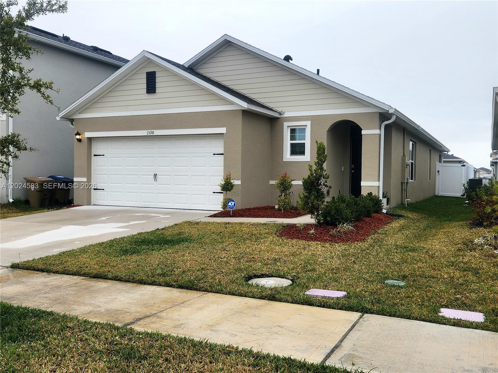 you are looking for a newly built home that is ready to move in then look no further! This 2025 home features 3 bedrooms, 2 baths , double car garage and a privacy fence for you to enjoy your outdoor space. The home features plenty of light and flex spaces to decorate and furnish as you please. From the moment you walk in the front door you can appreciate all this home has to offer; an open kitchen concept with stainless steel appliances, shaker cabinets and a quartz countertop to enjoy your quick morning coffee. Your dining room gives you access to your fenced in backyard to enjoy your barbecues and family gatherings. The split bedroom plan offers a Primary ensuite Bedroom with dual sink and shower combination.2 guest bedrooms share a guest bathroom making it perfect for your out of town guests. You can even use one as your office/den. All rooms have been virtually staged with furniture including the backyard. The community offers a community pool, fitness center , tennis courts and walking trails. Kissimmee is close to all family attractions including Disneyworld. All pictures have been Virtually Staged.