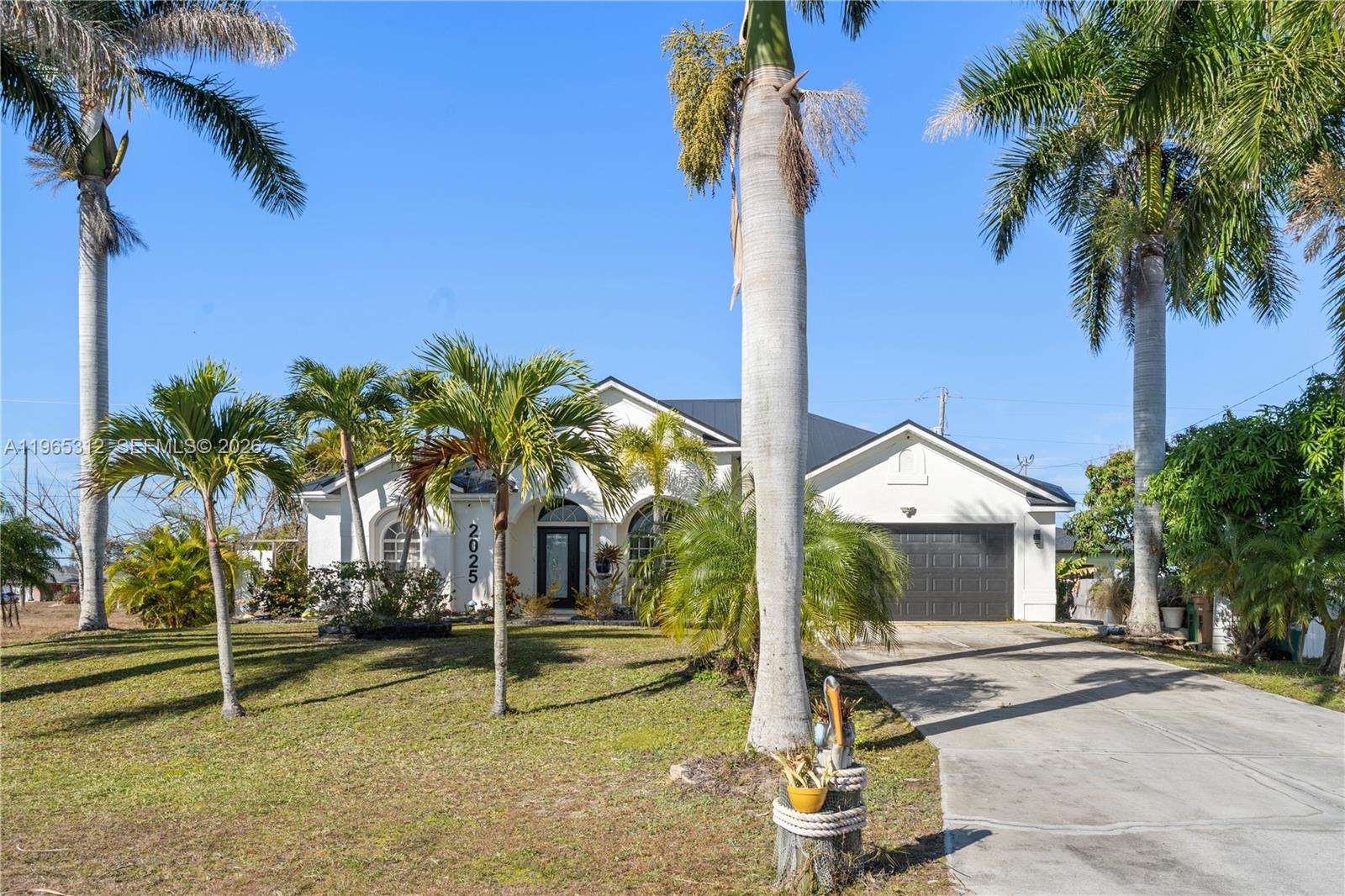 A spacious three-bedroom, plus den, two-bathroom home is situated in the northwest of Cape Coral. The thoughtfully designed floor plan features a kitchen that is privately separated from the front entrance, providing enhanced functionality and privacy. Open living areas are ideal for entertaining, while the split-bedroom layout offers comfort for both family and guests. Year-round Florida living is experienced with a private in-ground pool enclosed within a screened lanai. Additionally, the generous lot offers ample space for outdoor enjoyment. This property, conveniently located with an attached garage and metal roof, offers easy access to a school, public library, and major roadways. Its ideal location makes it suitable for either a primary residence or an investment opportunity.