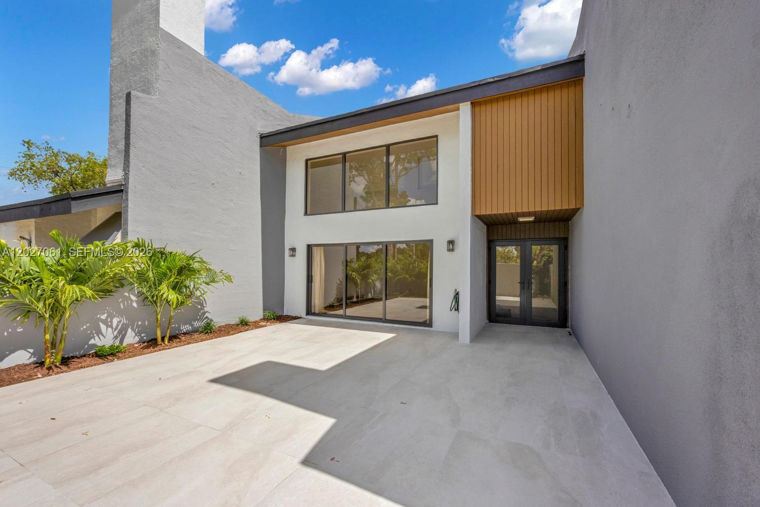 Welcome to The Banyans of South Miami, a highly sought-after community offering an exceptional blend of comfort, style & convenience. Completely remodeled and move-in ready, this spacious 3-bedroom, 2.5-bathroom townhome features hurricane impact windows, beautiful wood-look porcelain tile flooring throughout, and a stunning modern kitchen with custom cabinetry, quartz countertops, stainless steel appliances, designer backsplash & a large breakfast bar. The home includes 2 parking spaces total, consisting of a private 1-car garage and 1 additional assigned space. Enjoy both a welcoming front porch & private back porch, perfect for relaxing, BBQs, and entertaining family & friends. Near top-rated schools, The Fresh Market, Sunset Drive, US-1, Metrorail, UM, Coral Gables & Coconut Grove.