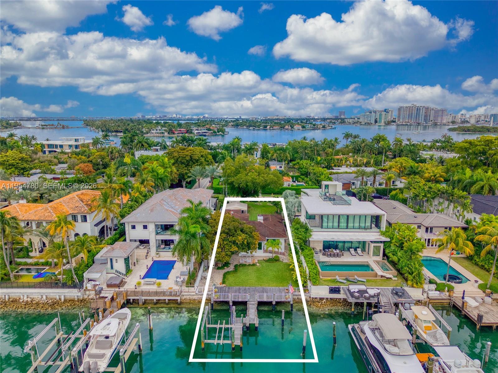 Welcome to Hibiscus Island with endless opportunity to build your dream home! Located on one of the most exclusive Islands in Miami Beach. This 3 Bed 2 Bath Fully updated home with impact windows sits on a 10,500 Sqft Lot ready for expansion. The Lot has 60 feet of waterfront linear footage, boat lift up to 20,000 lbs with direct Bay and Ocean access, with unimaginable downtown views! The Island has 3 Tennis courts, Kids Park, Basket Ball Courts, 24 Hour Security. You are minutes from South Beach, Downtown and Wynwood featuring worldclass dining, restaurants and shops!