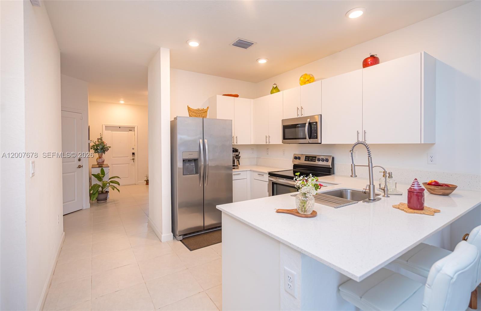 Spacious and beautifully designed 4-bedroom, 2-bathroom townhouse in Pine Vista, Homestead, offering comfort, functionality, and modern style with impact windows. This home features an open-concept layout with high ceilings, wide hallways, and abundant natural light that fills the space, creating a bright and inviting atmosphere throughout.

Enjoy a well-appointed kitchen with quartz countertops and stainless steel appliances that seamlessly connect to both the formal living room and a separate family room—perfect for entertaining or everyday living. The thoughtful floor plan provides plenty of space for relaxation and privacy. 

Located in a community with resort-style amenities, residents can enjoy features such as a pool, clubhouse, and recreational areas that elevate everyday living.

A perfect blend of space, style, and lifestyle in a growing Homestead community—don’t miss this opportunity to call it home.