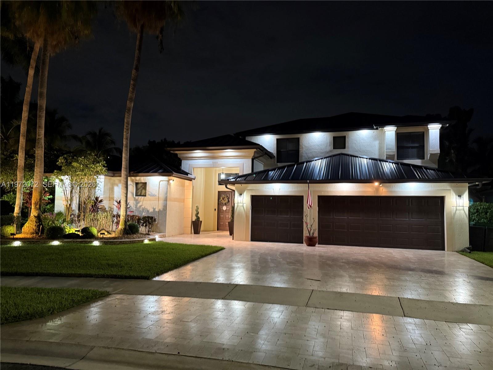 Experience turnkey luxury in this fully renovated courtyard estate in gated Sunset Lakes. Featuring 7 bedrooms and 5 full baths—including a detached pool house suite with private bedroom and bath—this home combines scale, privacy, and exquisite finishes. The main home offers 6 bedrooms, 4 remodeled bathrooms, 12-foot ceilings, and a 3-car impact garage.

No detail was overlooked: new metal roof, gutters, impact windows, new flooring throughout, recessed lighting, and fully renovated baths. The gourmet kitchen is completely new, equipped with upgraded appliances, pot filler, separate filtered water faucet, quartzite countertops, custom pantry, and built-in wine chiller.

Step outside to a private backyard oasis. The saltwater pool and spa were fully redone in 2023 with new pump, heater, and heat/chiller system for warm winter days or cool summer dips. Patio, driveway, and walkway replaced in 2023. Enjoy evenings with hot/cold outdoor shower, soffit lighting, and integrated mosquito system—perfect for effortless entertaining. Security system and alarm in place .The house and concrete fence were painted in 2024 

A rare move-in-ready home with upgrades and luxury finishes rarely found in the community. Residents enjoy clubhouse amenities including pool, tennis, basketball, and fitness center.