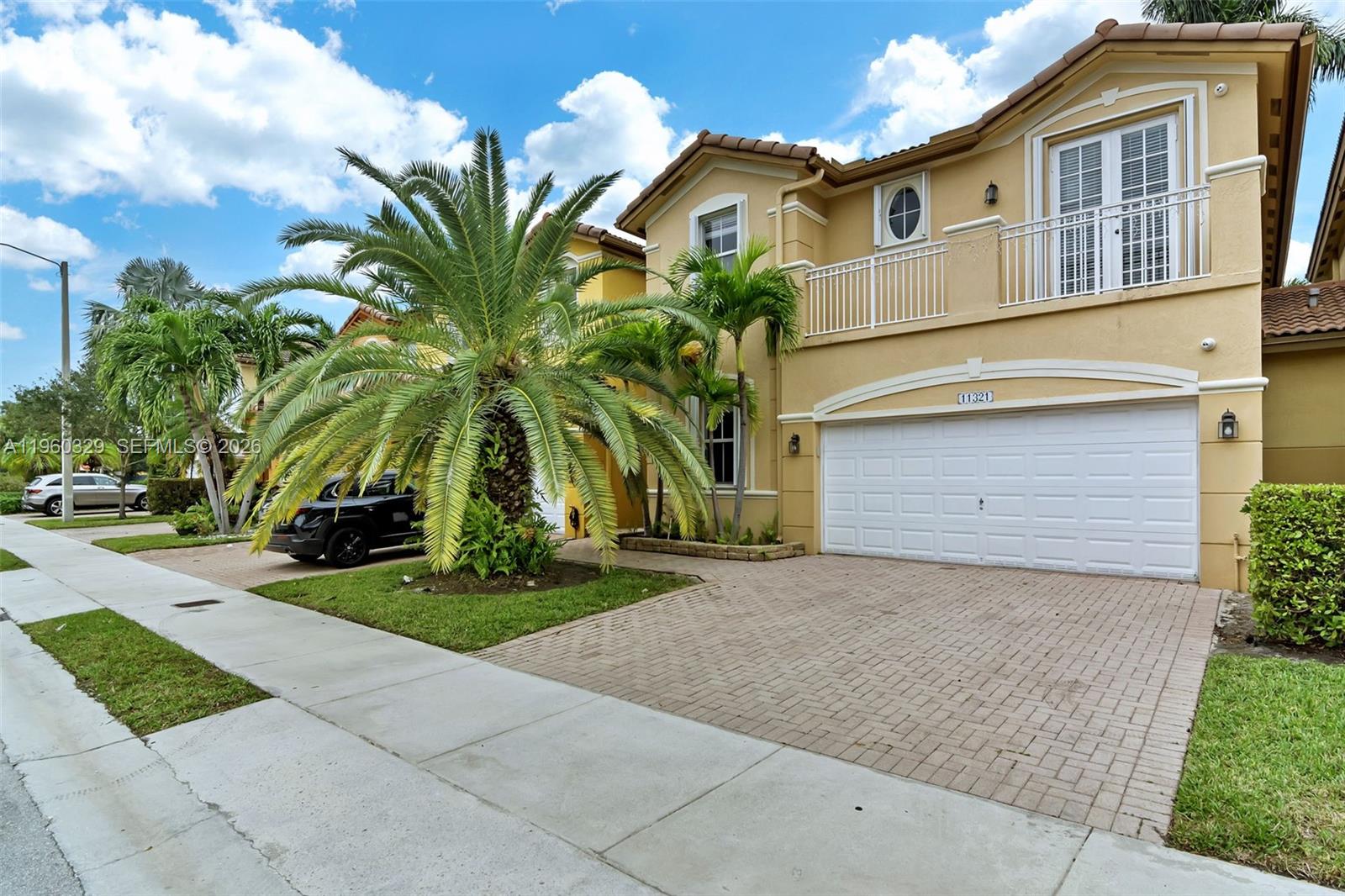 Move-in ready and vacant at closing! Tenant required to vacate upon sale. This spacious 5-bed, 3-bath home in Madeira II at The Islands at Doral offers the perfect family layout with a bedroom and full bath on the first floor. Enjoy an open-concept design, modern kitchen with granite counters and stainless appliances, plus smart home tech you control from your phone and a full video surveillance system for peace of mind.
Step outside to a large paved backyard with no rear neighbors and palm tree views — ideal for entertaining. Walk to the community pool, clubhouse, A-rated schools, and Legacy Park. Double garage, remodeled baths, and prime Doral location near everything. Priced to sell fast — don’t miss this one!