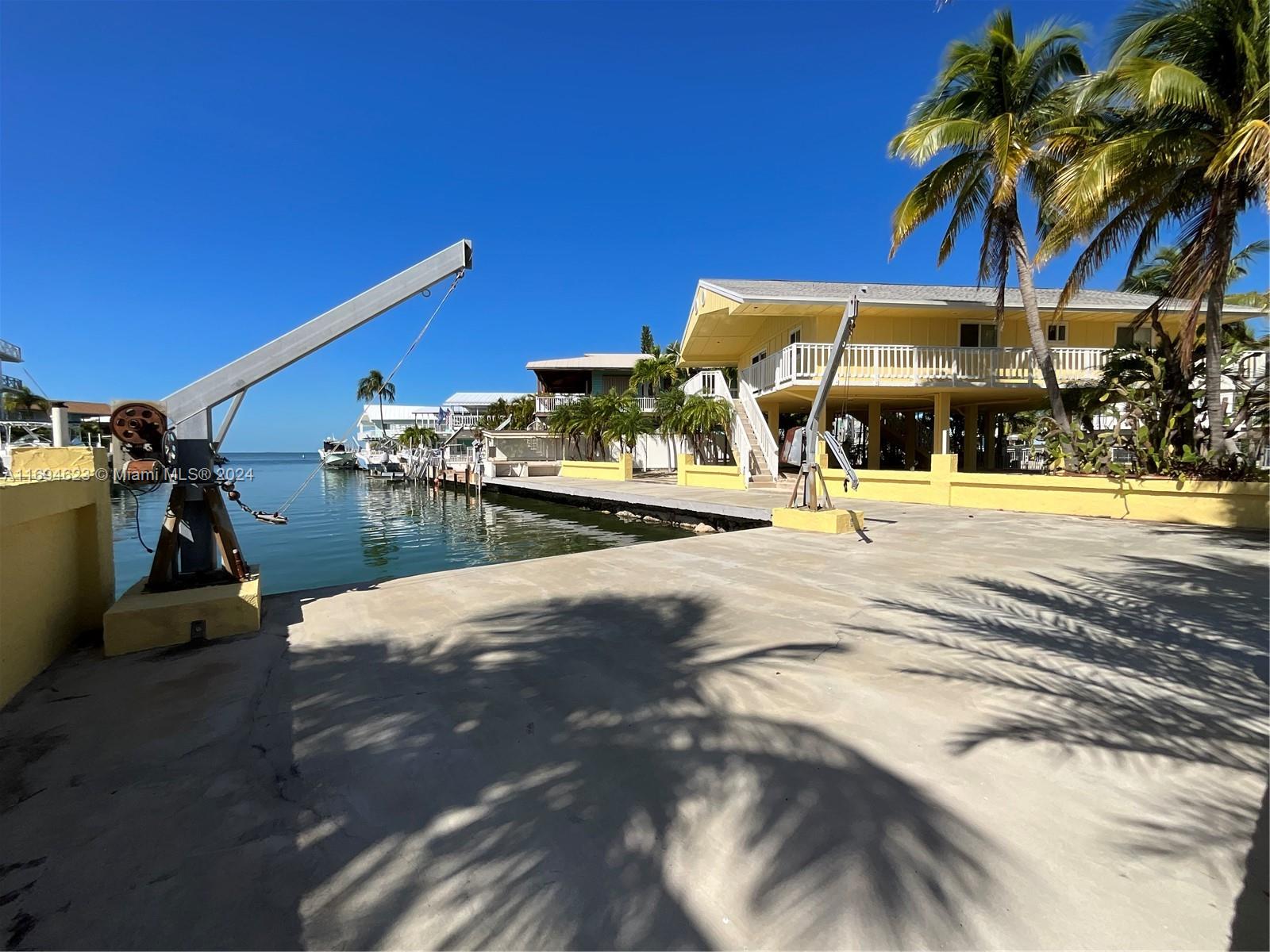 Experience breathtaking Bayviews in Hammerpoint with an incredible 97-foot dockage! Imagine watching stunning sunsets from your L-shaped dock or your home patio, all in the comfort of your home. This spectacular three-bedroom, two-bath gem boasts upstairs laundry room w/beautifully updated bathrooms, along with a kitchen any chef would love these views while cooking in paradise. Nestled on a spacious corner lot, this property offers a generous 6,452 sq ft of land built in 1986. Solid shingle roof, ample room for all your boats & water toys, setting the scene for unforgettable BBQs & outdoor celebrations! Plus, you’ll love the enormous carport that promises plenty of room for your RV & boat trailers. Don’t miss out on this fantastic opportunity to embrace ultimate waterfront lifestyle!