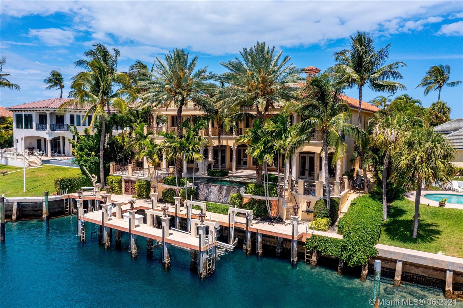 Remarkable Direct Intracoastal Estate located in One of the Most Sought After No Wake Zone Waterways in Boca Raton. This One of A kind Residence was built w/ no expense spared & quality of construction  that would rival any single family home. Using only the highest quality finishes & unbelievable attention to detail throughout. Boasting 10,128 SF w/ 8 Bedrooms plus club room, gym, library, office & home theater spread over 3 levels w/ an elevator to each floor. Cappuccino marble floors w/ onyx inlays, cherry wood cabinetry, mahogany doors, pecky cypress ceilings & garage doors, 4 car garage w/ slabs of Santa cecelia gold granite & cappuccino marble staircase are just some of the features inside.  A/C boathouse, concrete boat dock, full home generator & dockage for up to 90' vessel.