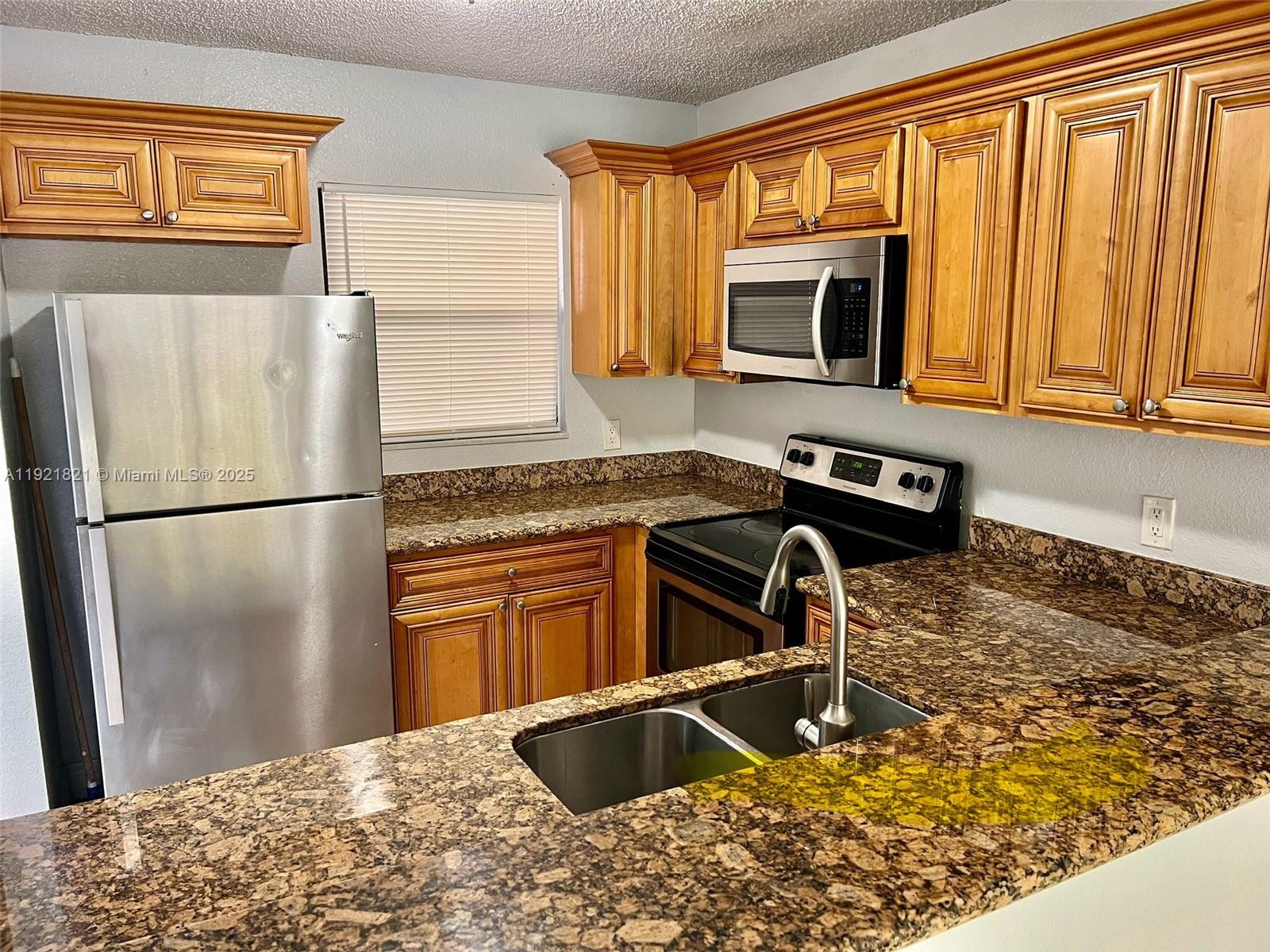 Water view unit!!! This spacious 2 bedroom, 2 bathroom condo is located on the second floor, open floor plan that seamlessly connects the living room, dining area, and kitchen with marble counter tops and stained steel appliances. The living room is filled with natural light, creating a bright and inviting space perfect for relaxation and entertainment and an amazing lake view from the living area and master bedroom! The master bedroom is spacious and includes an ensuite bathroom and a large closet. The second bedroom is also generous in size and includes a closet and easy access to the second bathroom. Enjoy in-unit laundry, assigned parking, and access to the community pool and clubhouse. close to the FL Turnpike, restaurants and shopping!Min 600 credit score!!