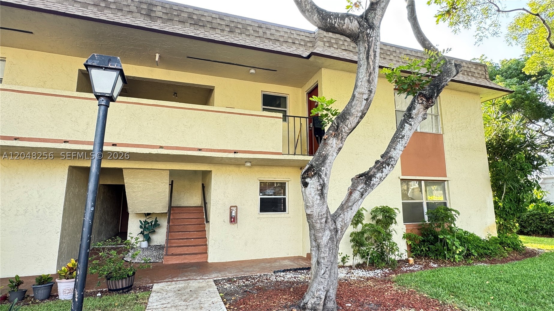 Spacious first-floor 2-bedroom, 2-bath condo offering comfort, convenience, and great potential. This unit features tile flooring throughout the main living areas, a bright living/dining room, and a functional kitchen with granite countertops, wood cabinetry, and stainless steel appliances. Both bathrooms have been updated, and the primary suite offers a walk-in closet with built-in shelving. Enjoy the convenience of first-floor living with easy access and no stairs. The enclosed patio/Florida room provides extra space for storage, relaxing, or future improvements. Great opportunity for buyers looking to personalize and add value. Conveniently located near shopping, dining, major roads, and everyday essentials. A solid option for owner-occupants or investors. Schedule your showing today.