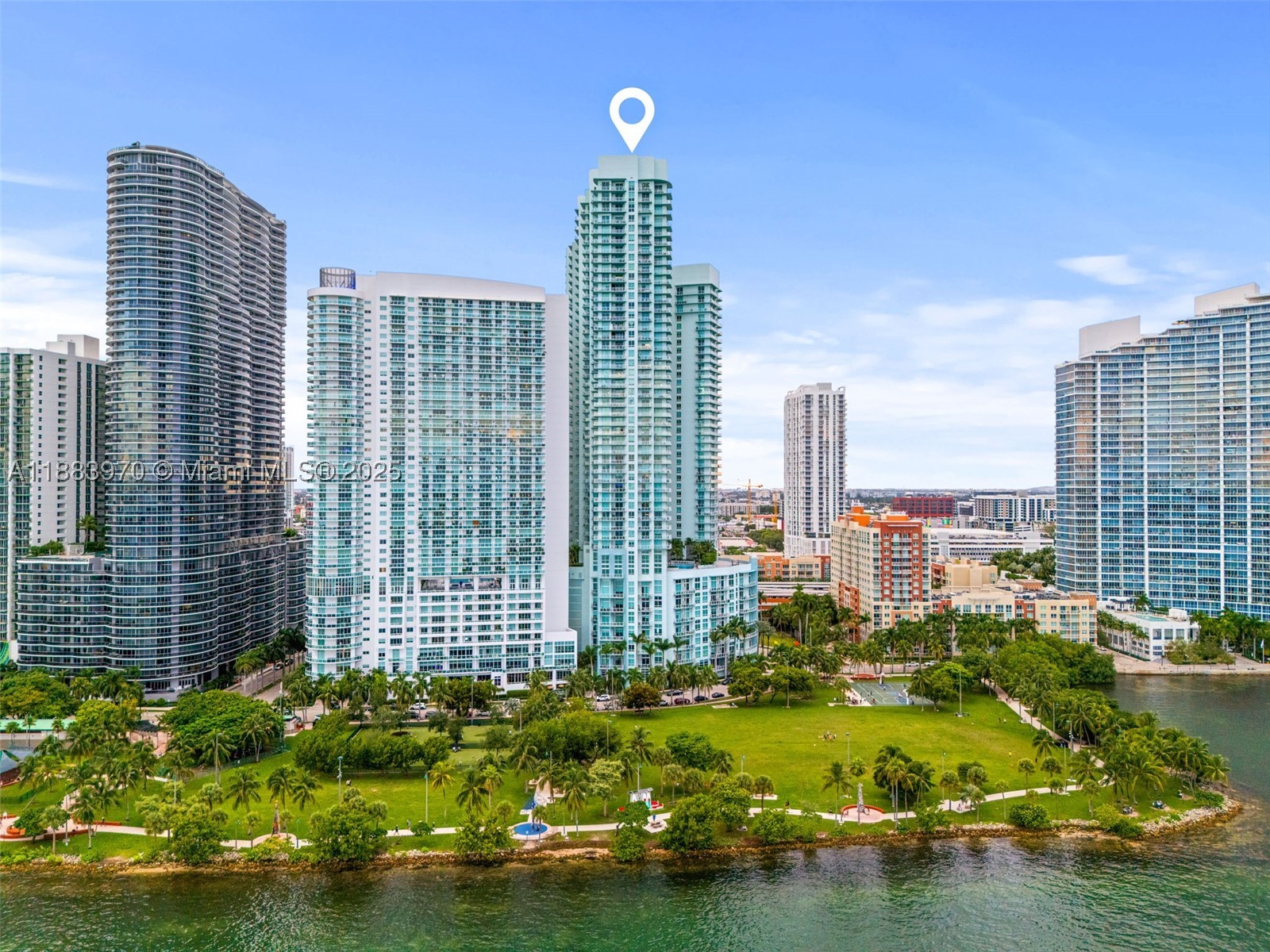 This charming condo unit located on the 40th floor comes with an incredible panoramic view of Biscayne Bay and the Miami Skyline! Tile flooring, 2 large bedrooms, 2 1/2 bathrooms, and a spacious wrap-around balcony to enjoy the view, especially during sunset. Unit has an open floor plan. This condominium provides amazing amenities, including 24-hour concierge and security, valet parking, two swimming pools, a two-story fitness center, sauna, club room, art gallery, theater room, and convenience store. Walking distance from Wynwood, Midtown, and Brickell. Don't miss it!