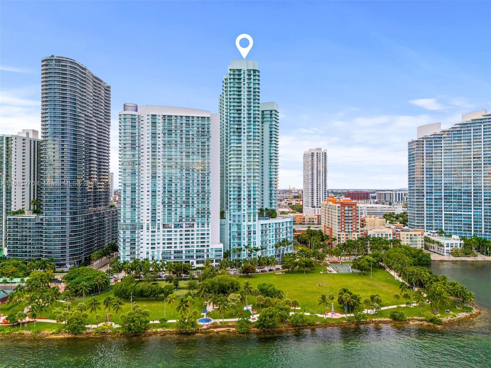 This charming condo unit located on the 40th floor comes with an incredible panoramic view of Biscayne Bay and the Miami Skyline! Tile flooring, 2 large bedrooms, 2 1/2 bathrooms, and a spacious wrap-around balcony to enjoy the view, especially during sunset. Unit has an open floor plan. This condominium provides amazing amenities, including 24-hour concierge and security, valet parking, two swimming pools, a two-story fitness center, sauna, club room, art gallery, theater room, and convenience store. Walking distance from Wynwood, Midtown, and Brickell. Don't miss it!