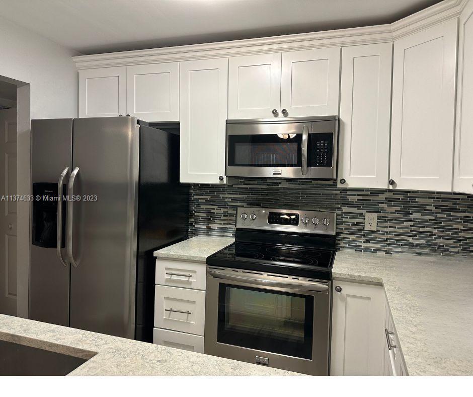 Renovated 1st floor 2/2 home with a 3rd bonus room located in the beautiful sought after French Quarter. Gorgeous kitchen with beach vibes (Montgomery Quartz Cambri), very nice wood tile floor throughout, a peaceful lanai with extra storage, impact windows & slider, and in unit washer and dryer, plus NEW Electric Panel. What more could you ask for? This well-maintained community offers 2 pools, tennis court, clubhouse, BBQ area, car washing area, and ample guest parking. Maintenance includes cable, water, garbage, lawn roof and exterior of bldg. Only HO6 needed. Conveniently located to shopping, highways, parks, golf, dining and more. 20-25% down required. Cash or Conventional loans only. 1 pet 20lbs or less permitted. Pending assessment will be paid in full by Seller prior to closing.