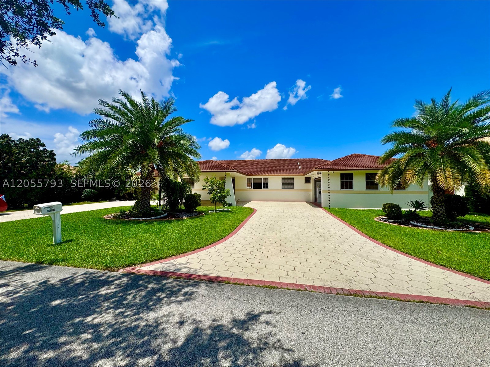 A beautiful custom-built single-story home offering exceptional scale, privacy, and architectural presence,  3,502 sq. ft. of refined living area, high-impact doors, and a stunning outdoor retreat featuring a sparkling pool, manicured front landscaping, and fruit trees. This home includes 4 bedrooms and 3.5 bathrooms, with a versatile room ideal for  one In-Law Suite provide unmatched comfort and flexibility. Additional highlights include two central A/C systems plus one A/C Split unit, a carport for 2  cars, and a circular driveway enhancing the estate-style curb appeal. A rare opportunity combining space, privacy, and exceptional design in a highly desirable location... won't last, great opportunity!