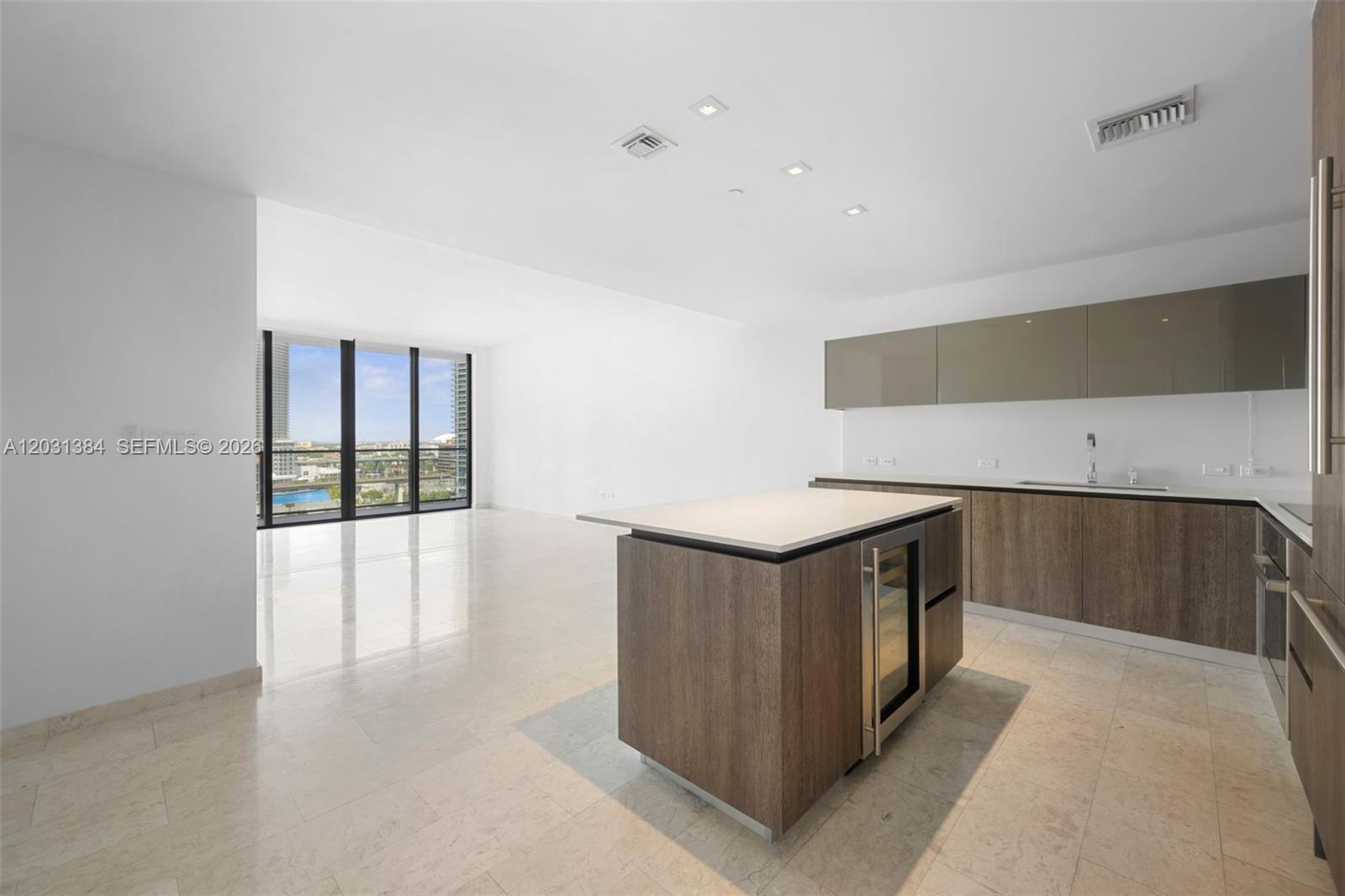 Experience elevated Brickell living in this unfurnished 2-bedroom, 2-bath residence at Reach. Thoughtfully designed with floor-to-ceiling glass, an expansive open-concept layout, premium finishes, and a built-in wine cooler, this home offers the perfect blend of sophistication and functionality. Enjoy a private terrace overlooking the vibrant city skyline while living just steps from Brickell City Centre's luxury shopping, acclaimed dining, and entertainment. Residents have access to an exceptional collection of resort-style amenities, including a state-of-the-art fitness center, rooftop pools, spa facilities, children's play areas, business center, concierge services, valet parking, and beautifully curated resident lounges. An outstanding opportunity to enjoy one of Miami's most desirable urban lifestyles.