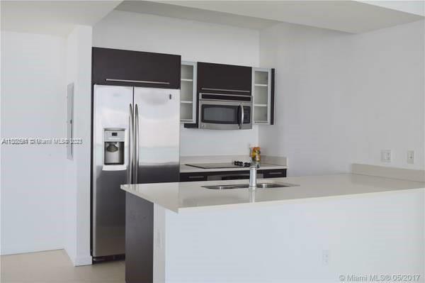 MODERN 1/1 PLUS A DEN (CAN BE USED AS AN OFFICE) , NEW TILE FLOORS , S. STEEL APPLIANCES WASHER/DRYER.CORNER UNIT WITH LARGE BALCONY,GREAT AMENETIES INCLUDES INFINITY POOL,HOT TUB,SAUNA,SUN DECK,GYM , ONE ASSINGED PARKING. IN THE HEART OF EDGEWATER CLOSE TO RESTAURANTS , PUBLIX. CLOSE TO MIDTOWN,WYNWOOD,DESIGN DISTRICT, BRICKELL.