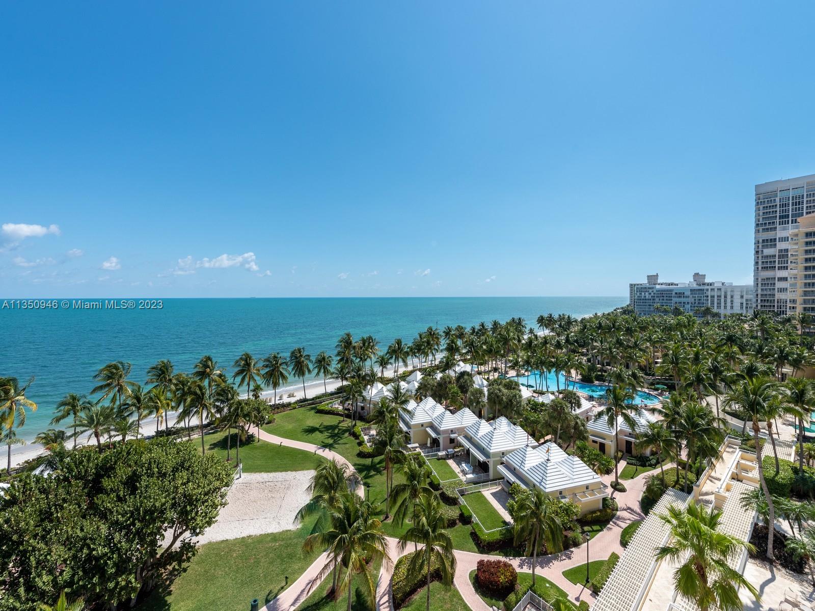 Beachfront house in the sky – The largest model apartment at Ocean Club **** 5,207 sq.ft. of luxurious space, was remodeled and redesigned by Adriana Hoyos in 2018.  Step out of your private elevator and enter your own grand foyer.  Be in awe with the panoramic views of sky and beach that surround you.  This 4 bedroom en-suite plus staff quarters, 5 bath plus powder room, plus
ocean facing office/den, and wrap around terraces, and four garage spaces (one is a tandem) is in a stack that has its own private concierge, fur storage room and its own wine cellar, all for your added convenience.  Ocean Club features three restaurants, Spa, round the clock security, and all amenities expected in a world class resort.  Easy to show.