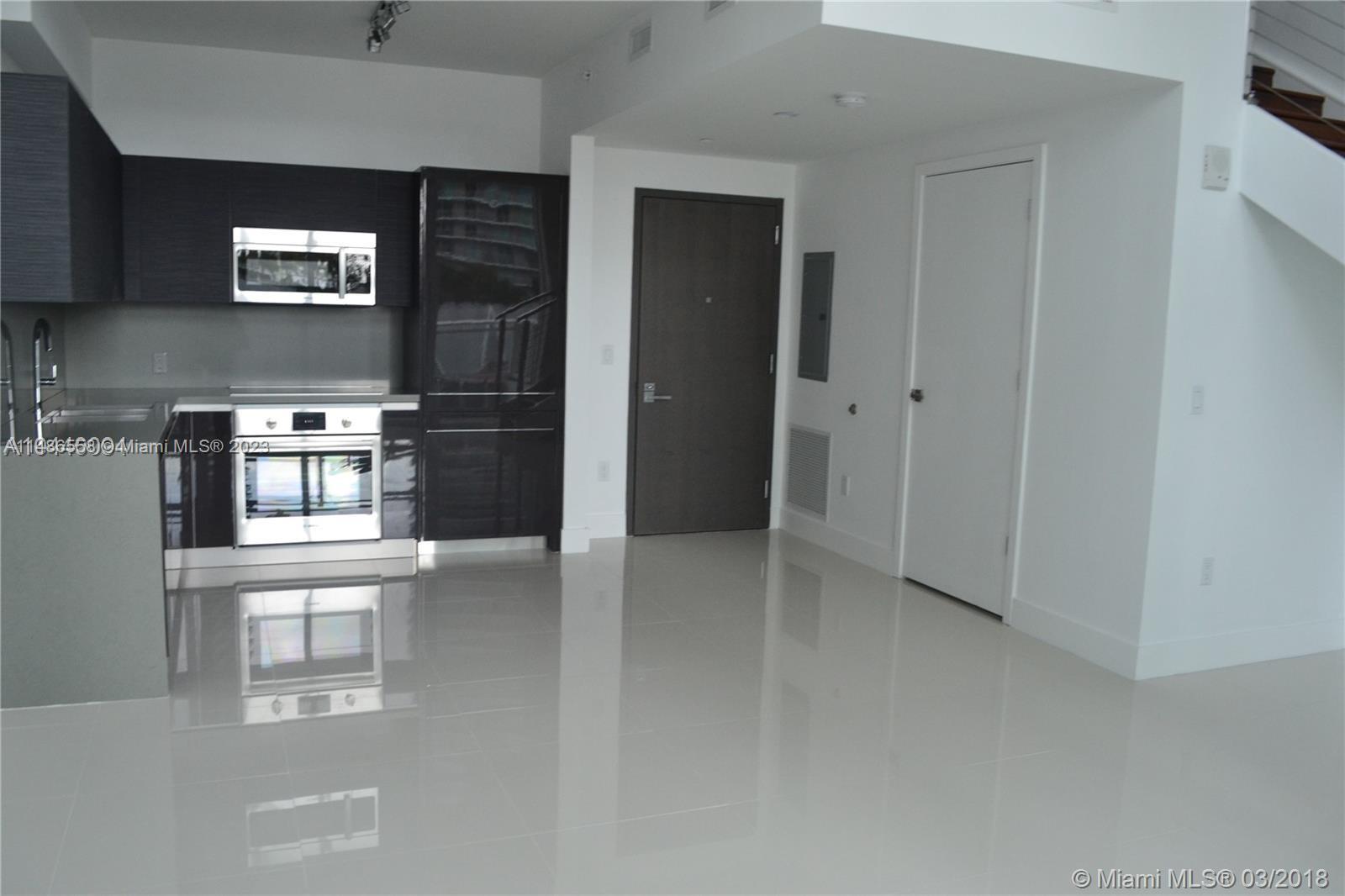 Loft style unit. The Bond on Brickell Avenue at the Financial District. This two level loft unit has a 1 Bedroom and
1.5 Bathrooms for a total of 950 sqft an open balcony facing the city. Unit fixture has European kitchen finish w/
Italkraft kitchen and Bosch appliances. Eggerman brush wood cabinetry along with porcelains fixture bathroom,
assigned parking space in the same level. Amenities included, Resort Pool, Cabanas, Library, Gym and more.