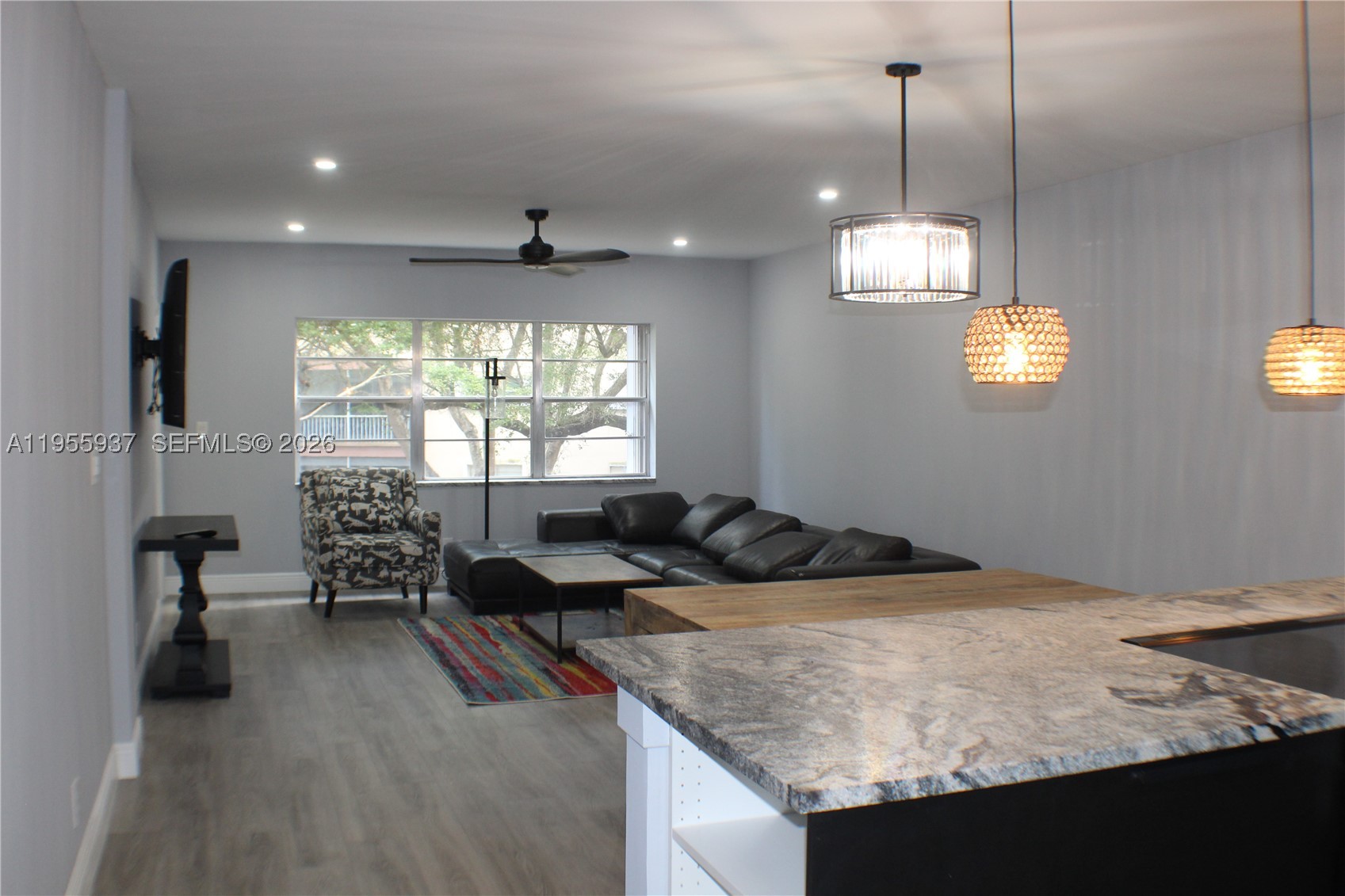 Your Dream Move-In Ready Condo Awaits – Renovated to Live In, Never Occupied! Step into luxury with this beautifully reimagined 1BR/1.5BA second-floor condo, located in a highly desirable 55+ community in the heart of Plantation. This unit was meticulously updated with premium finishes and thoughtful details intended for the owner's personal enjoyment—meaning absolutely no corners were cut. Because plans changed, you get the exclusive opportunity to be the very first to live in and enjoy this pristine, never-occupied remodel! Chef’s Dream Kitchen: Completely redesigned featuring brand-new, modern cabinetry, elegant granite countertops, and sleek, never-used Samsung stainless steel appliances. Sophisticated Interior: Fresh contemporary paint complements the brand-new luxury vinyl plank flooring stretching seamlessly throughout. Enjoy smooth ceilings, modern LED recessed lighting, and stylish new ceiling fans. Rest easy knowing the Central A/C is brand new (2026 Rheem) and the water heater was updated in 2021. The spacious primary bedroom boasts a generous walk-in closet and an ensuite bath. A beautifully updated half-bath perfect for guests. Unwind on your private, screened balcony offering a peaceful, breezy view of the courtyard.