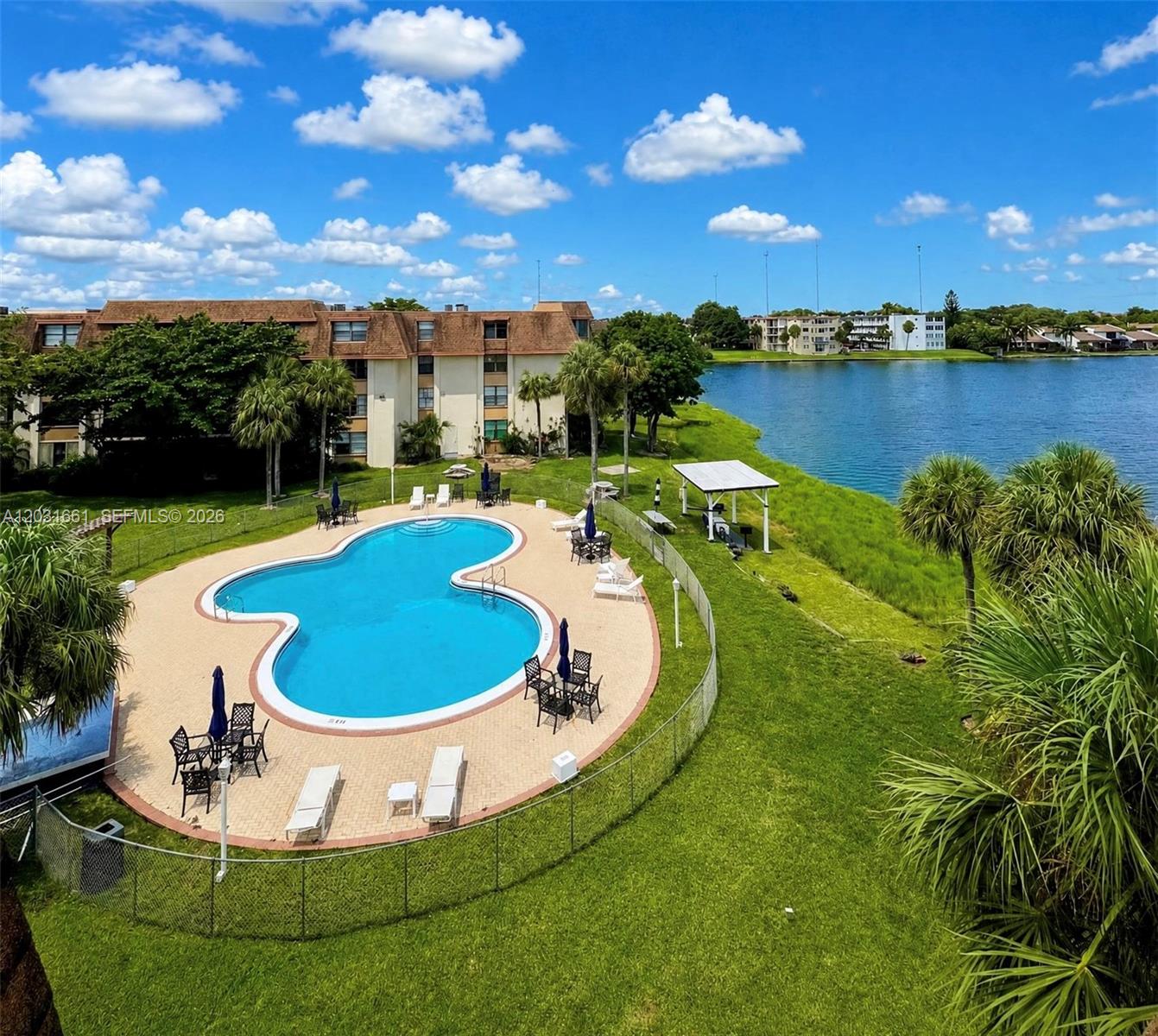 Corner 2-bedroom, 2-bath residence offering 1,253 sq ft of living space and breathtaking lake views. Enjoy an oversized enclosed balcony overlooking the water, a spacious primary suite with expansive walk-in closets, an additional storage unit, new windows, updated interior plumbing, and an upgraded electrical panel.
Residents enjoy a waterfront pool, fitness center, sauna, billiards/game room, BBQ/picnic area, and beautifully maintained grounds. A public park featuring a playground, dog park and walking paths is conveniently located across the street.
Ideally situated just minutes from Aventura Mall, Gulfstream Park, beaches, shopping, dining, I-95, and Fort Lauderdale-Hollywood International Airport, offering easy access to everything South Florida has to offer.
A rare opportunity to own a spacious waterfront home with spectacular sunset views and one of the most desirable lakefront settings in the community.
Some photos have been virtually staged.